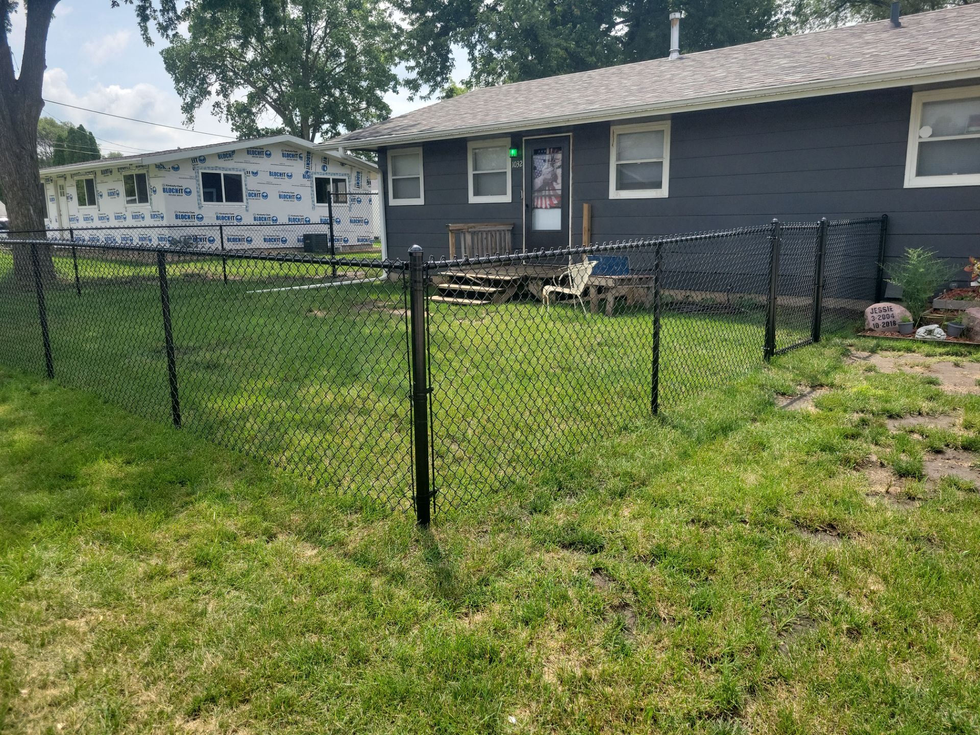 Black Chain Link Perimeter Fence Installation in Waterloo by Perfect Picket Fence and Stain