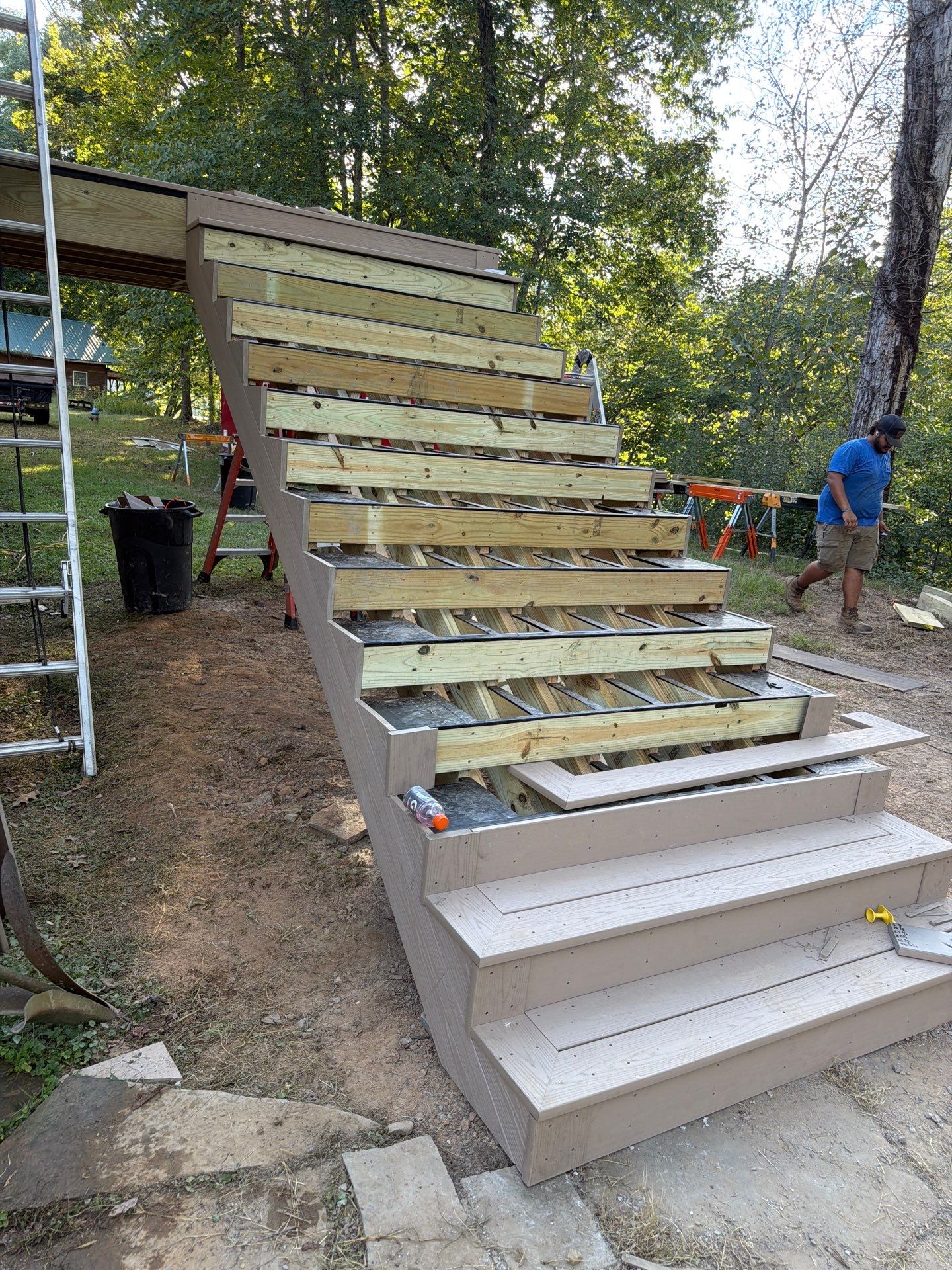Log Cabin Wrap-Around Deck and External Staircase Installation in Caldwell by Walnut Hollow Decks & Outdoor Living