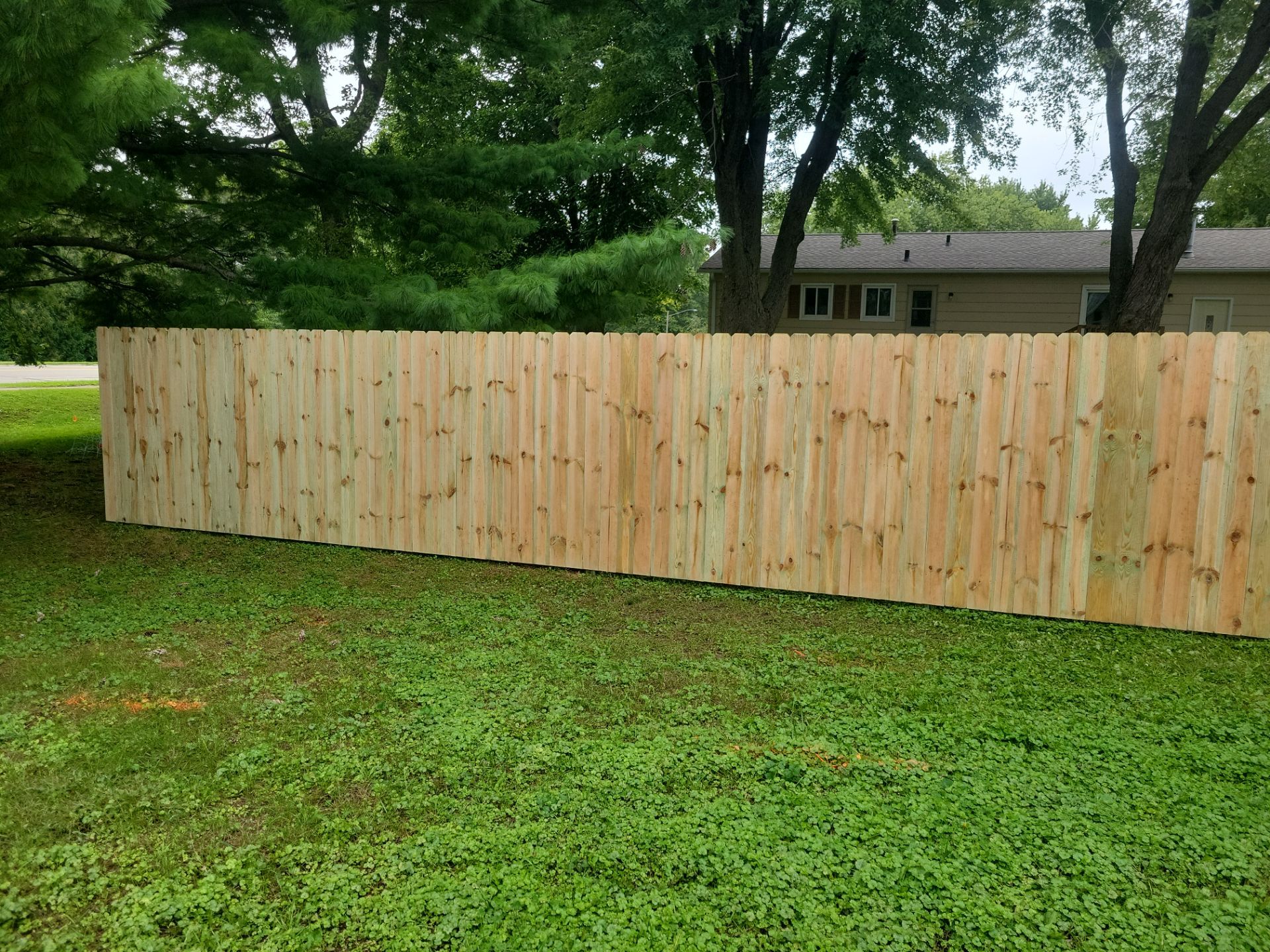 Pressure-Treated Wood Privacy Fence Installation in Waverly by Perfect Picket Fence and Stain