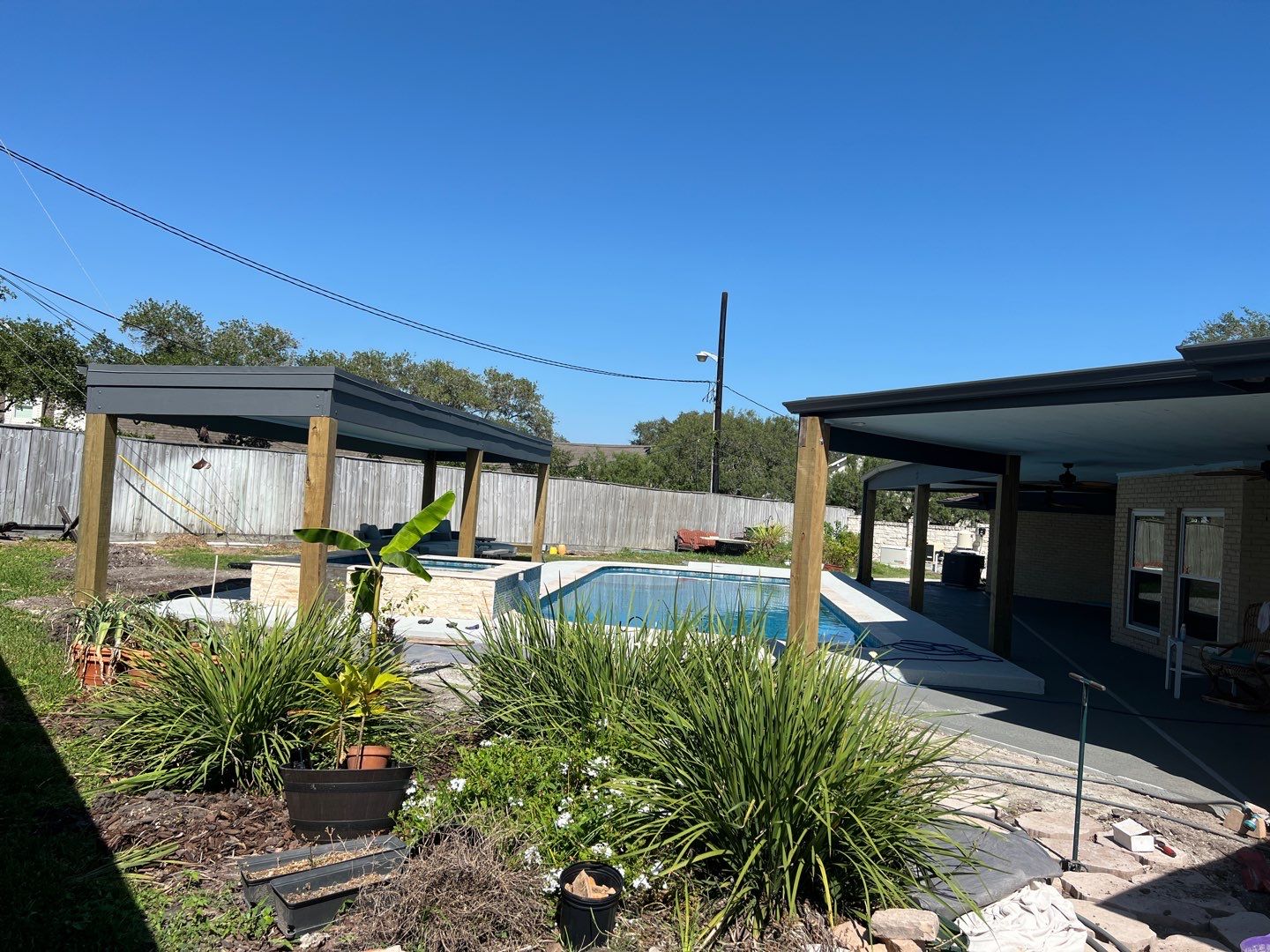 Beautiful pool side build by Bayfront Roofing and Construction
