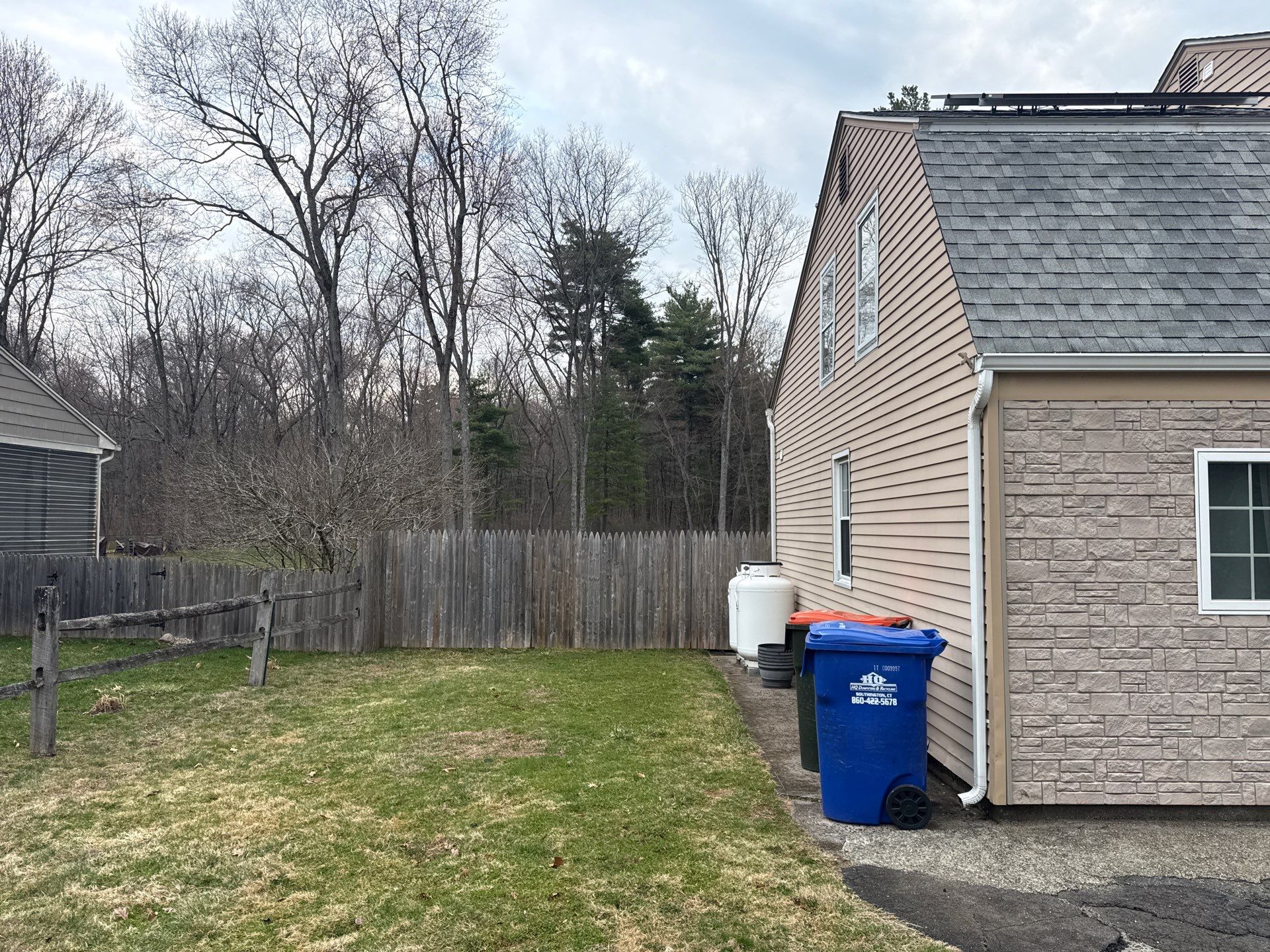 Exterior Home Renovation Underway in Southington: Siding, Stone Accents, and Solar Roof by Diamond Image LLC