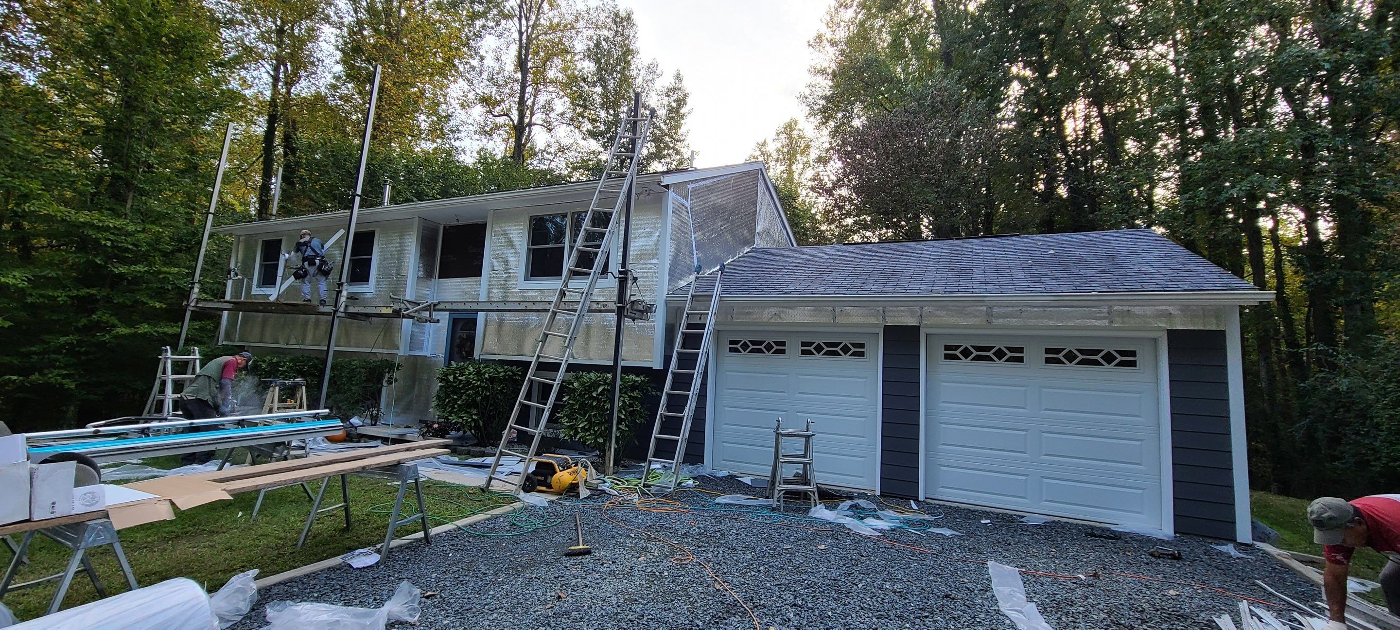 New James Hardie siding in Night Gray and Arctic White trim with LowE Wrap by Window Depot of Annapolis