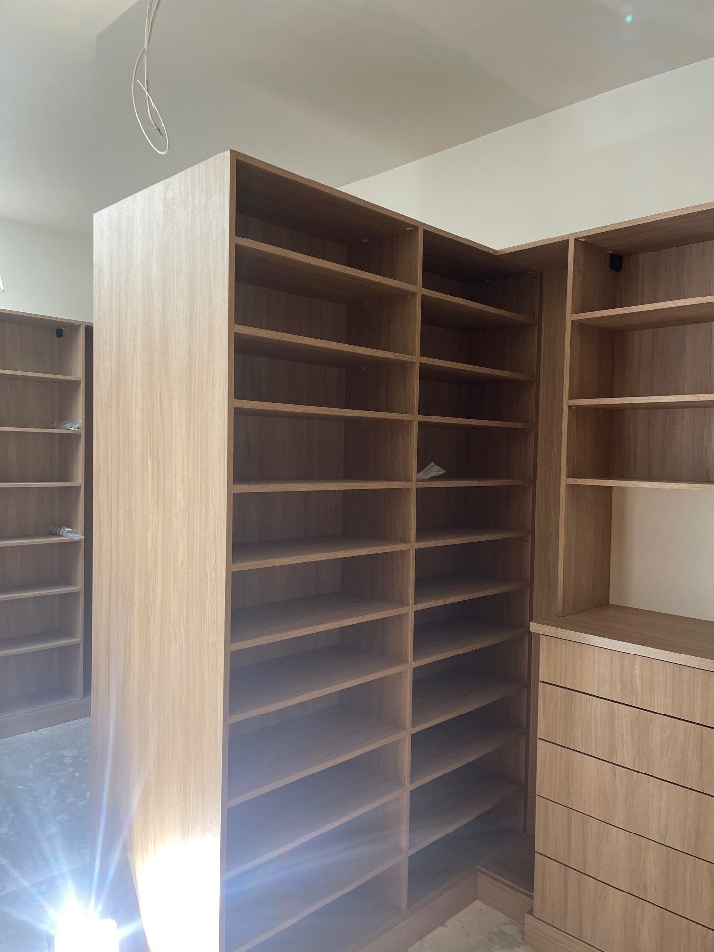 Expansive Primary Closet in Cherry Hills Village by Concept 32, Inc.