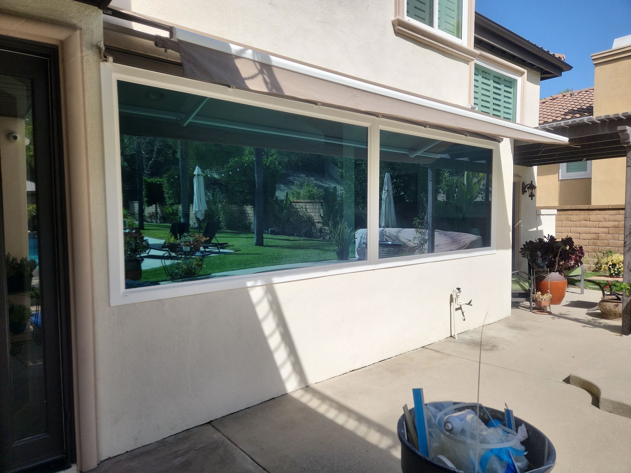 Window Installation using Anlin vinyl windows with Sunshield glass by American Window Company