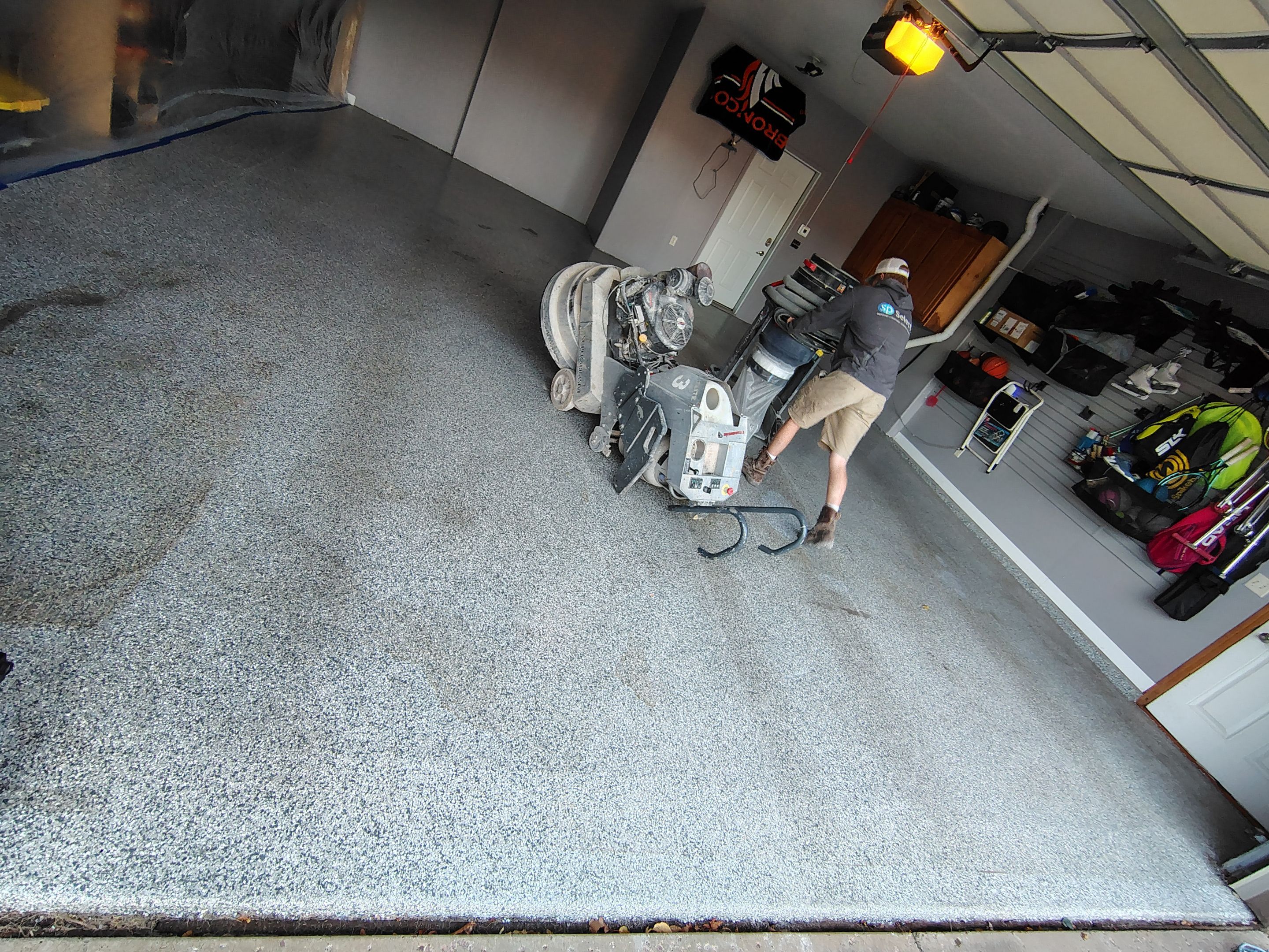 Grey Flecked Epoxy Garage Floor Installation in Sioux Falls by Select Painting, Coatings & Garage Cabinets