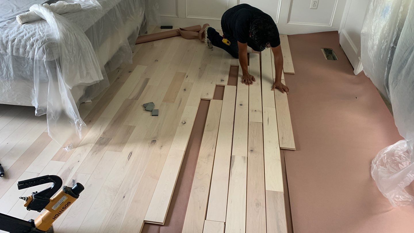 Flooring Installation using Maple Hardwood by Greenspring Construction Services