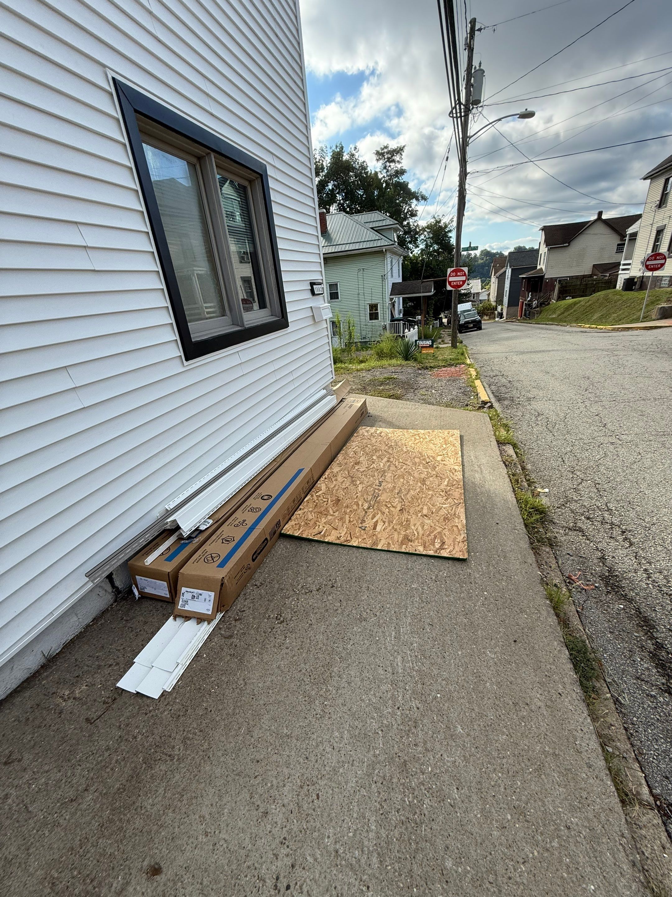 White siding  by Cousins Roofing Siding & Decks