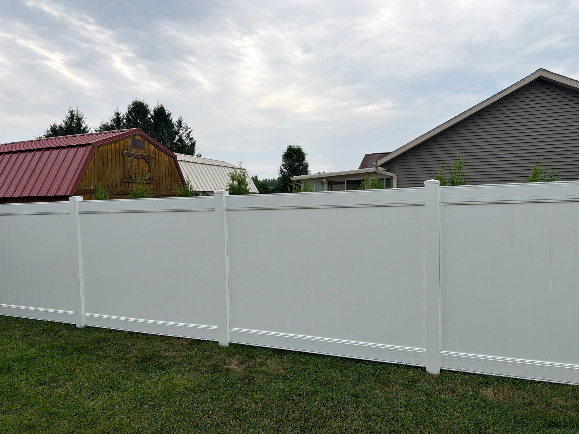 White Vinyl Privacy Fence and Double Gate Installation in Jesup by Perfect Picket Fence and Stain
