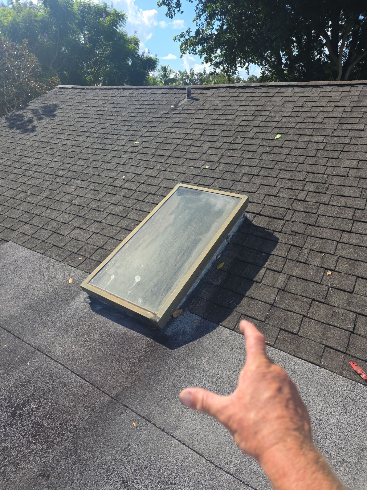 REPLACE NON APPROVED SKYLIGHT ALONG WITH CLOGED GUTTER by Morton Roofing, Inc.