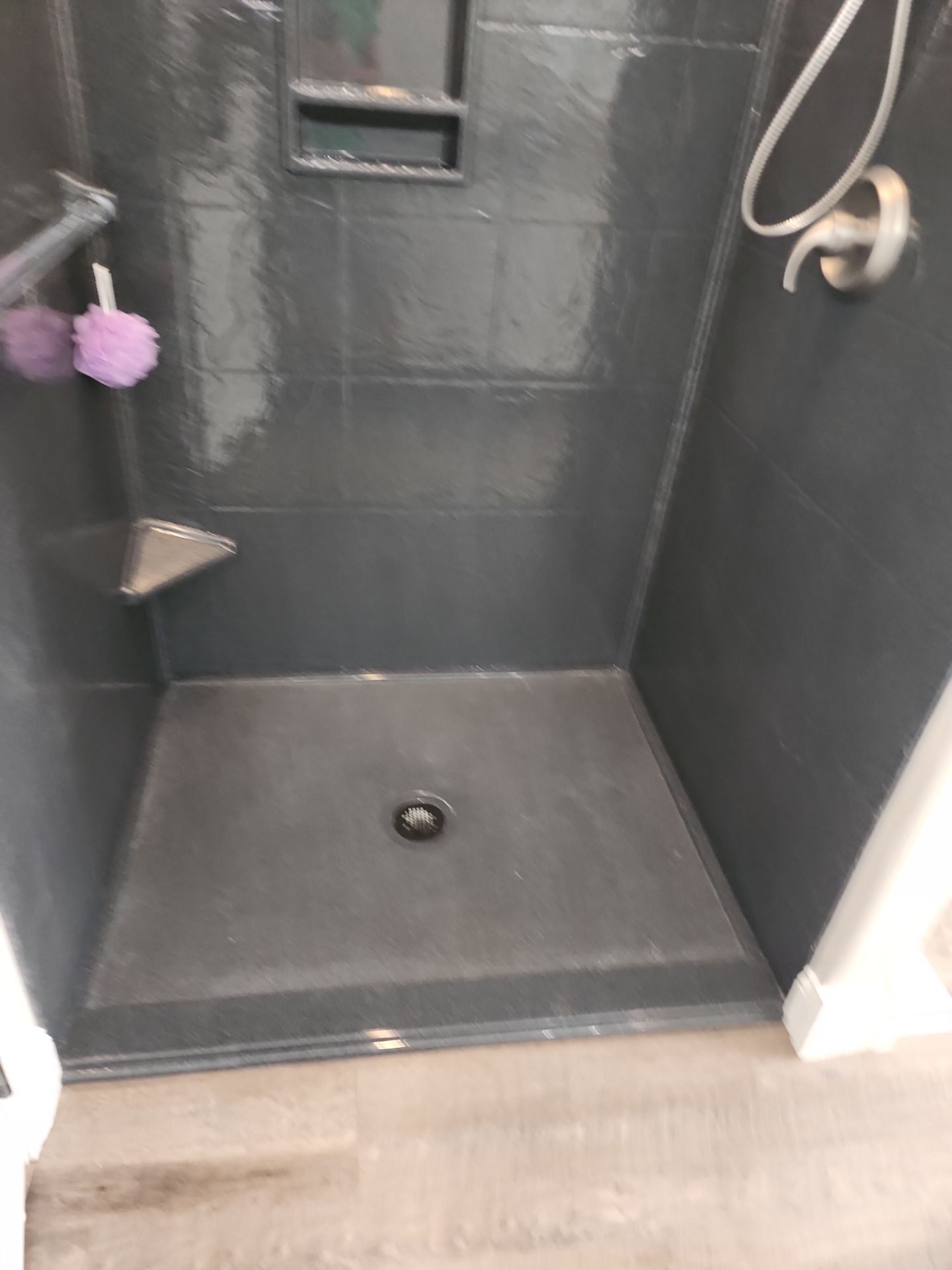 Master Bathroom Renovation Featuring Dark Textured Shower Panels in Branson West by Kitchen Works LLC