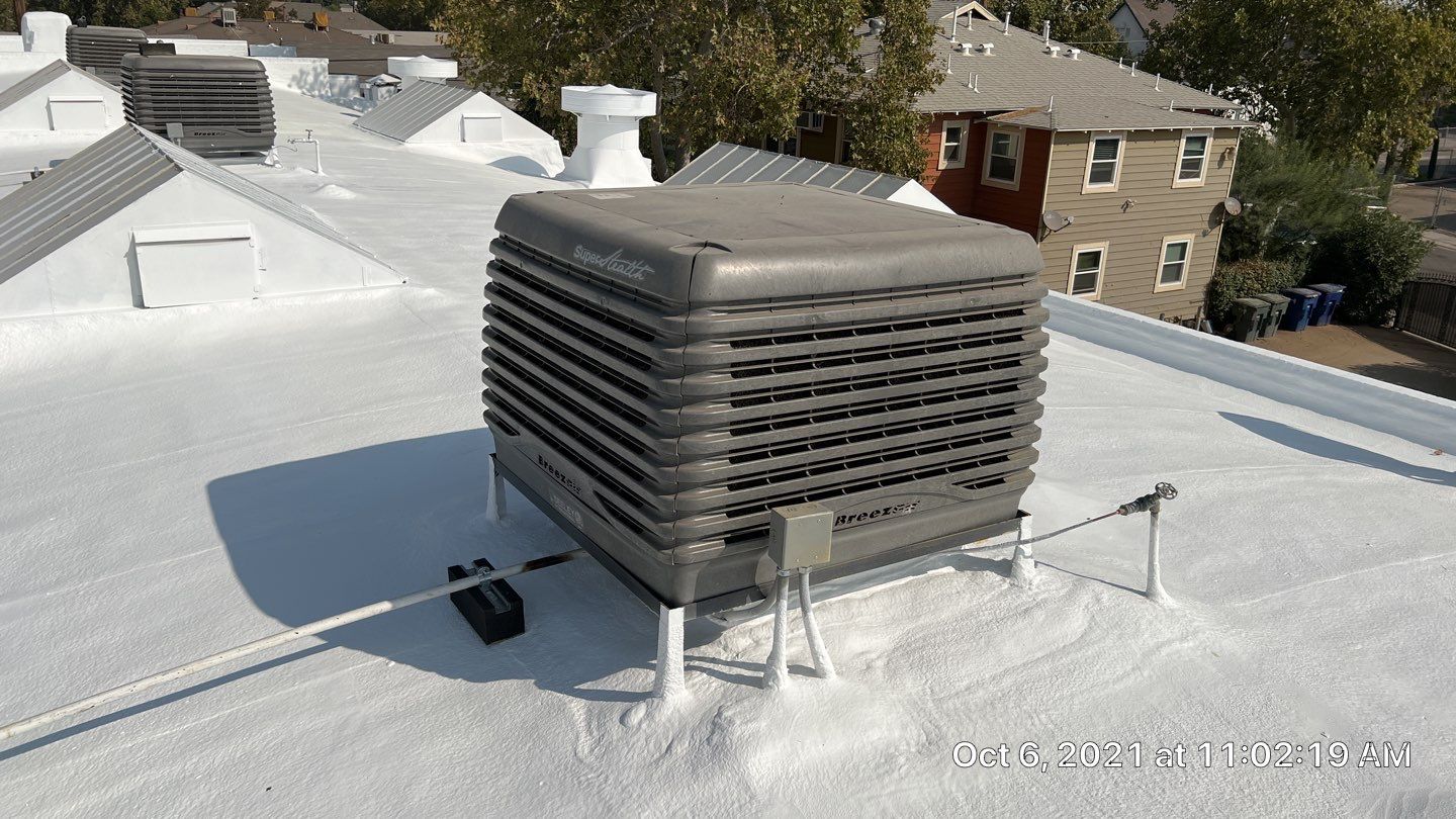 Polyurethane foam roof refurbish and recoating by Straight Edge Roofing Inc