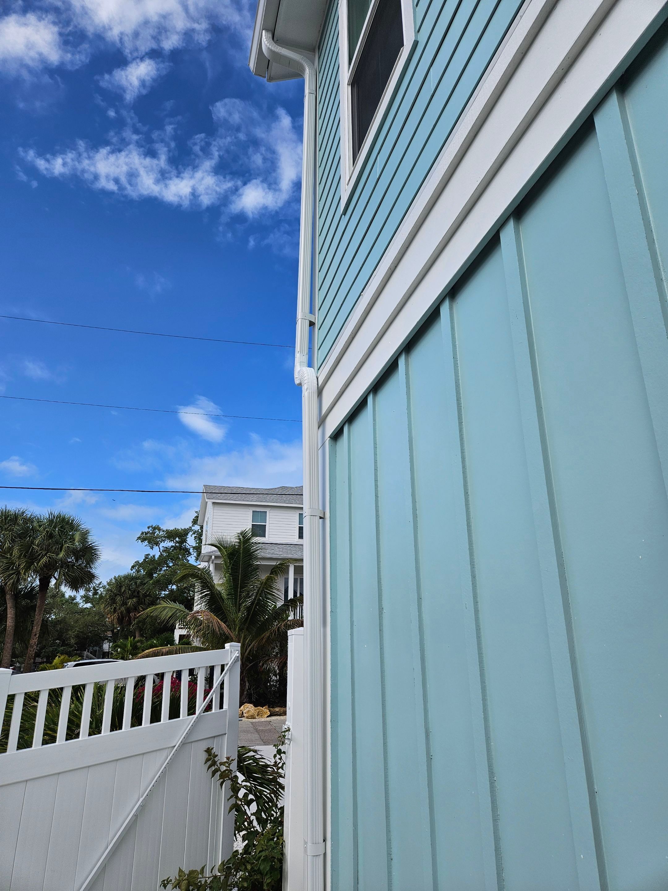 New White Seamless Gutters Installation and Downspouts, Reseal Gutters in Fort Myers Beach, FL  by Gutter Professors