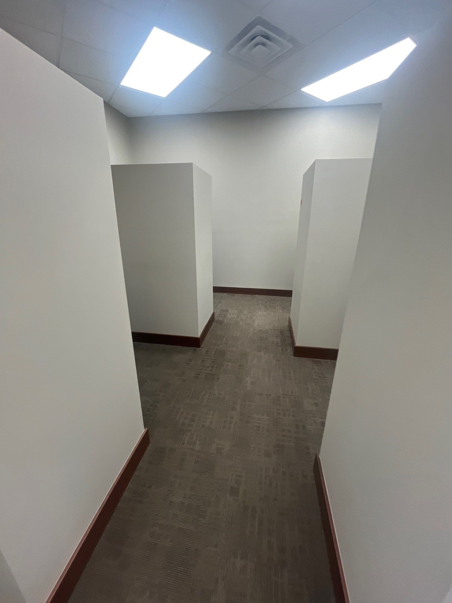 Commercial Office Interior Remodel and Modern Suite Refresh in Sioux Falls by Select Painting, Coatings & Garage Cabinets