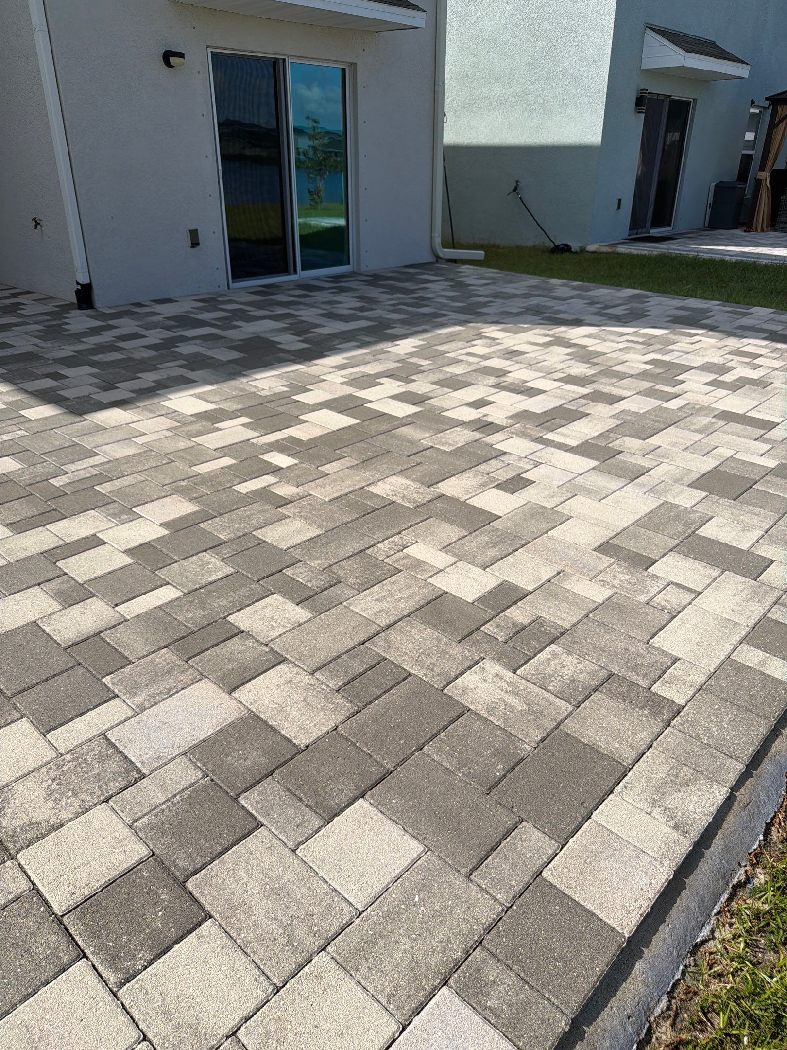 Paver Sealing and Restoration for Large Multi-Toned Patio in Wimauma by Supreme Paver Experts