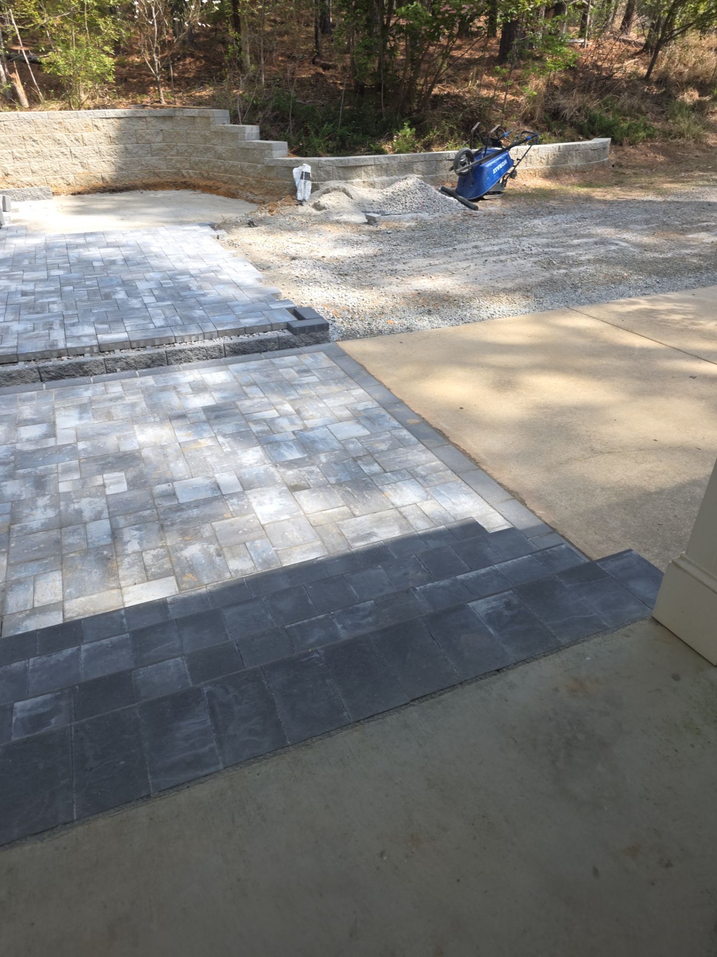 Pittsboro Outdoor Living Transformation – Retaining Wall, Paver Patio & Elevated Deck by Elite Remodeling and Design LLC