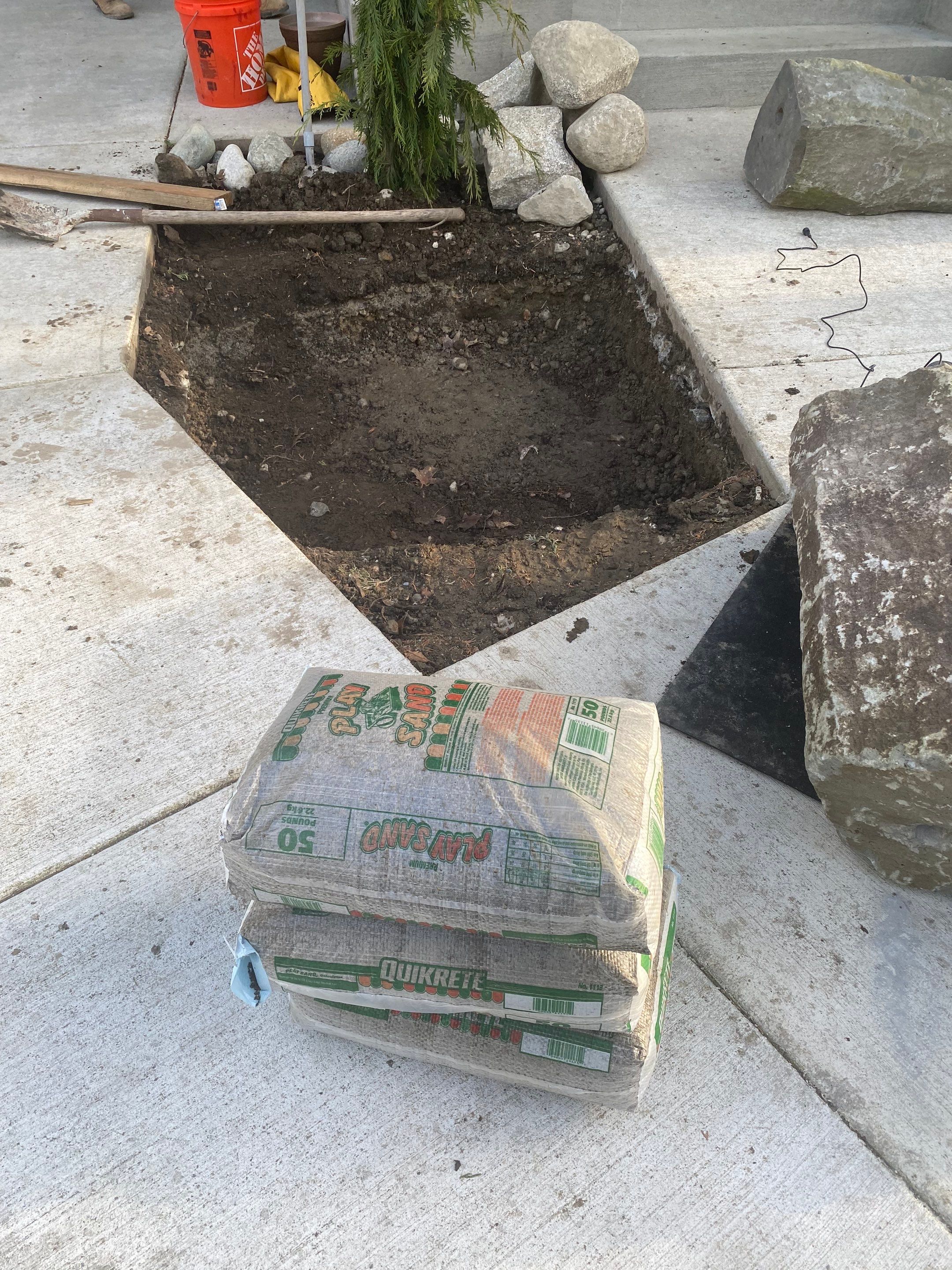 Patio Installation using Concrete, Retaining walls, and Turf install by Jireh Asphalt & Concrete Inc 