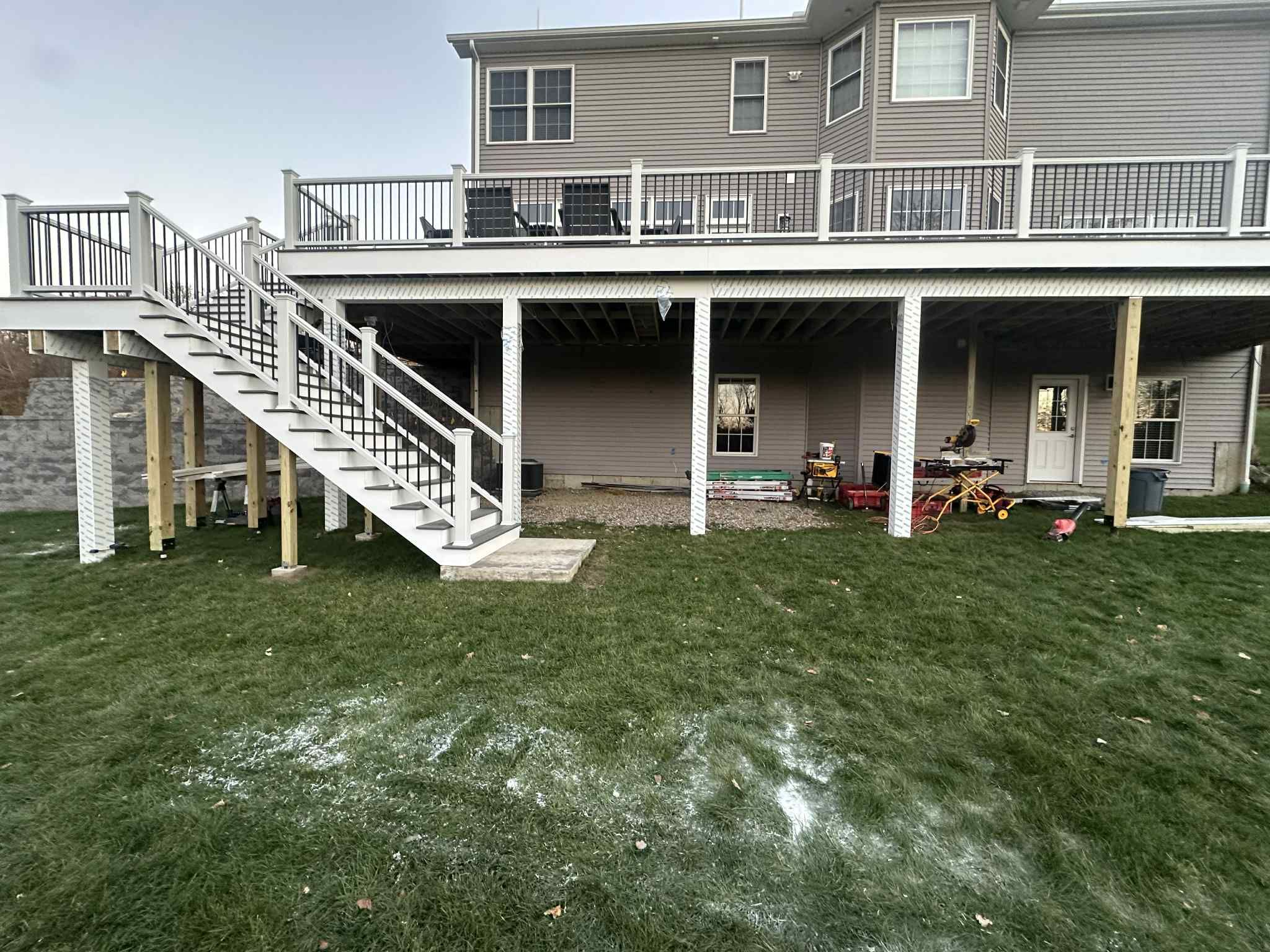 Deck replacement and expansion, With useable under space. Trex Tropical Island mist boards.  by DiGiorgi Roofing and Siding Inc