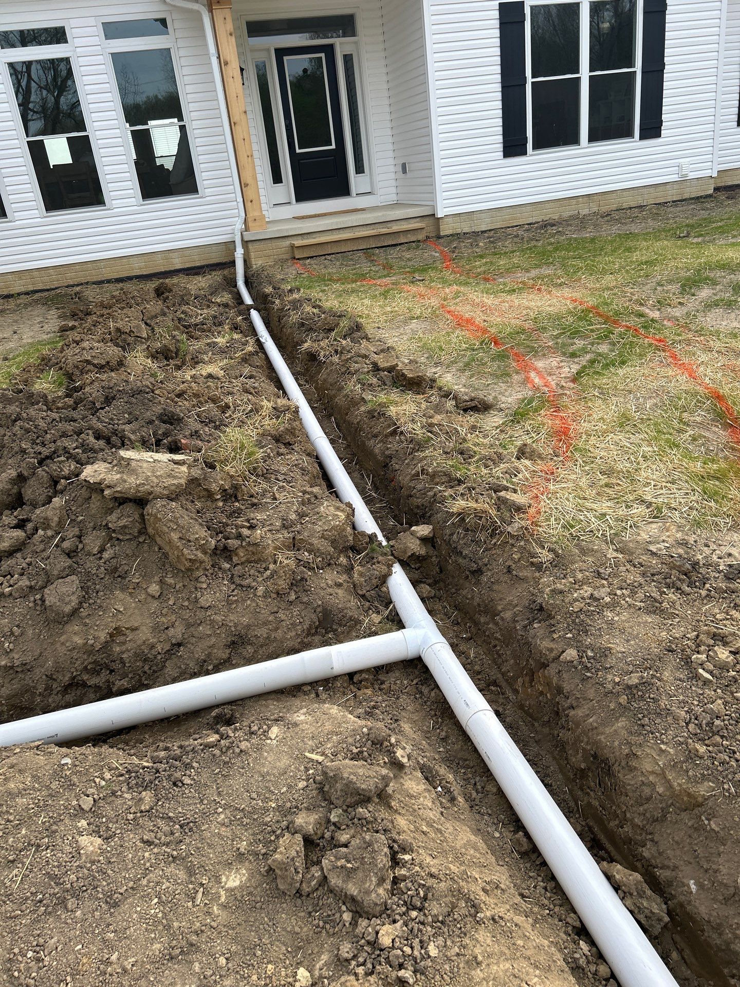 Custom Residential Concrete Walkways and Drainage Installation in Waldo by Concrete One Construction