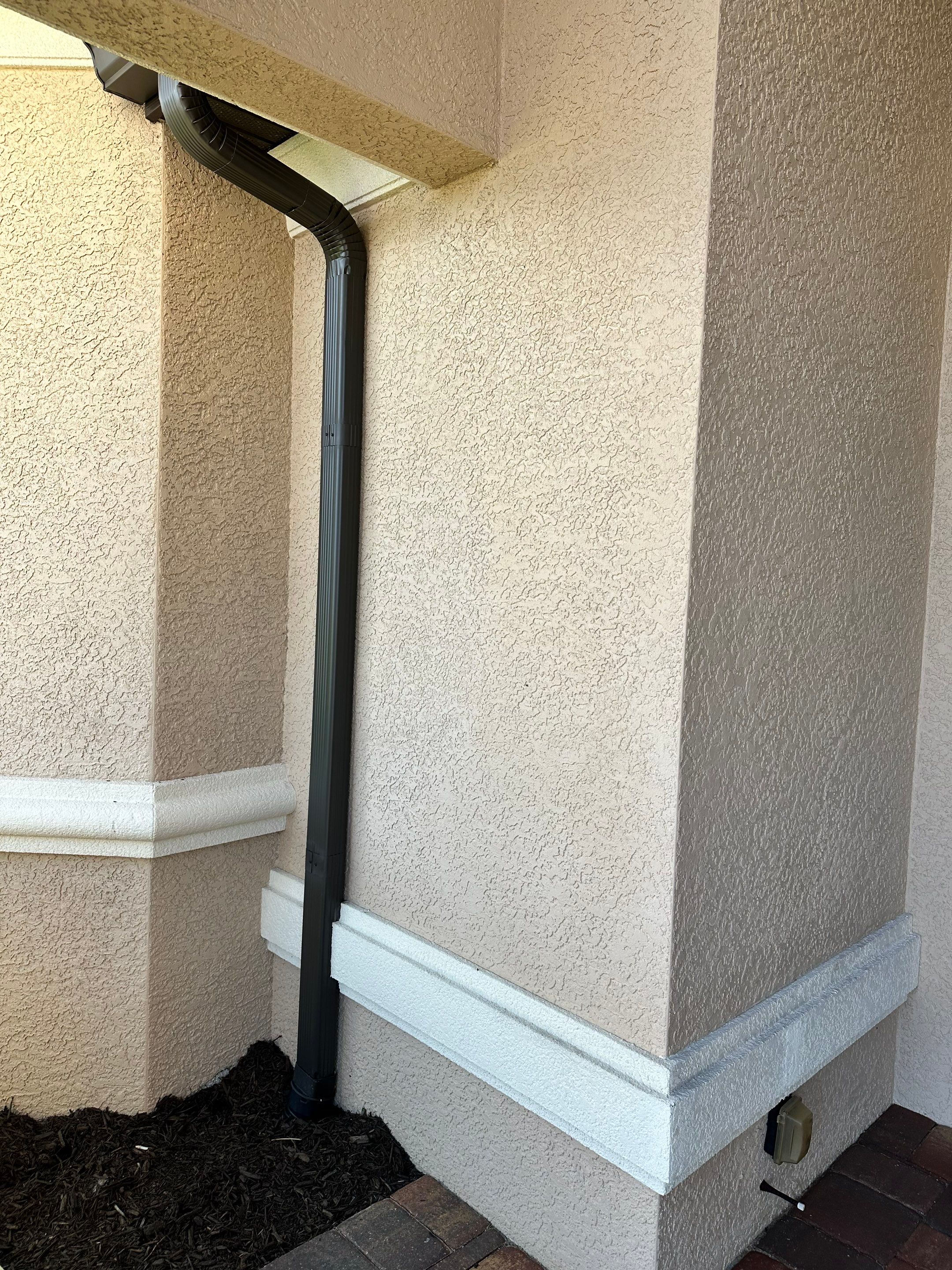 Bronze Downspout Installation in Cape Coral FL by Gutter Professors