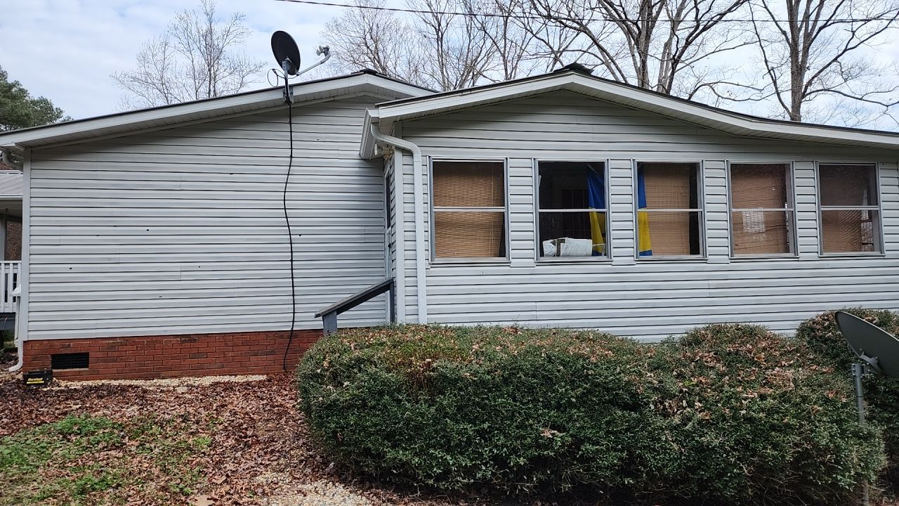 House Wash using cleaner by Power Wash Masters LLC