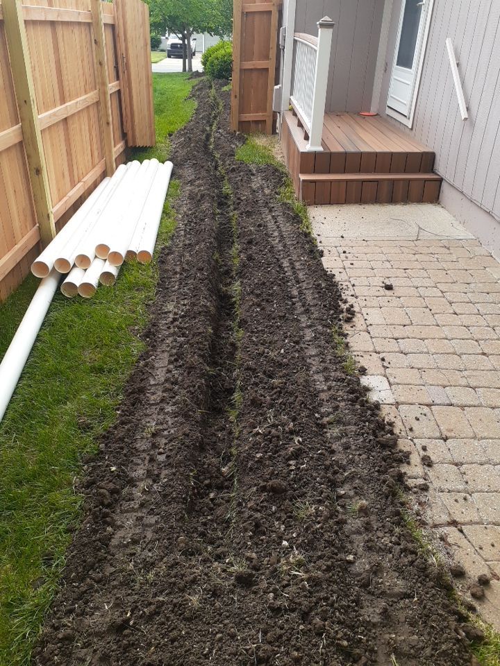 Drainage and Downspout Installation by LAND ESCAPES LLC