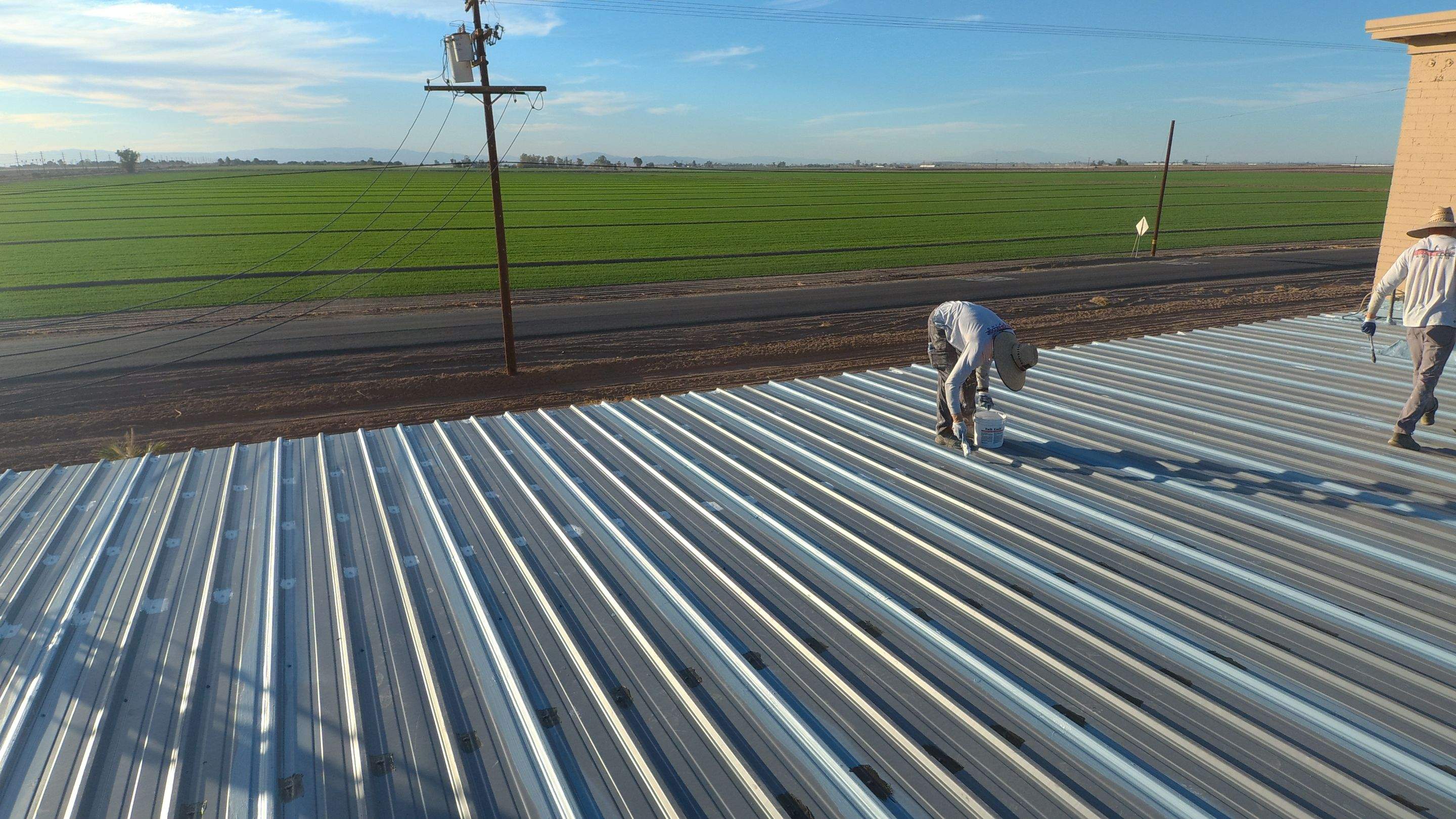 Metal roof restoration on commercial roof using Conklin Benchmark/PUMA XL fabric and coating by Straight Edge Roofing Inc