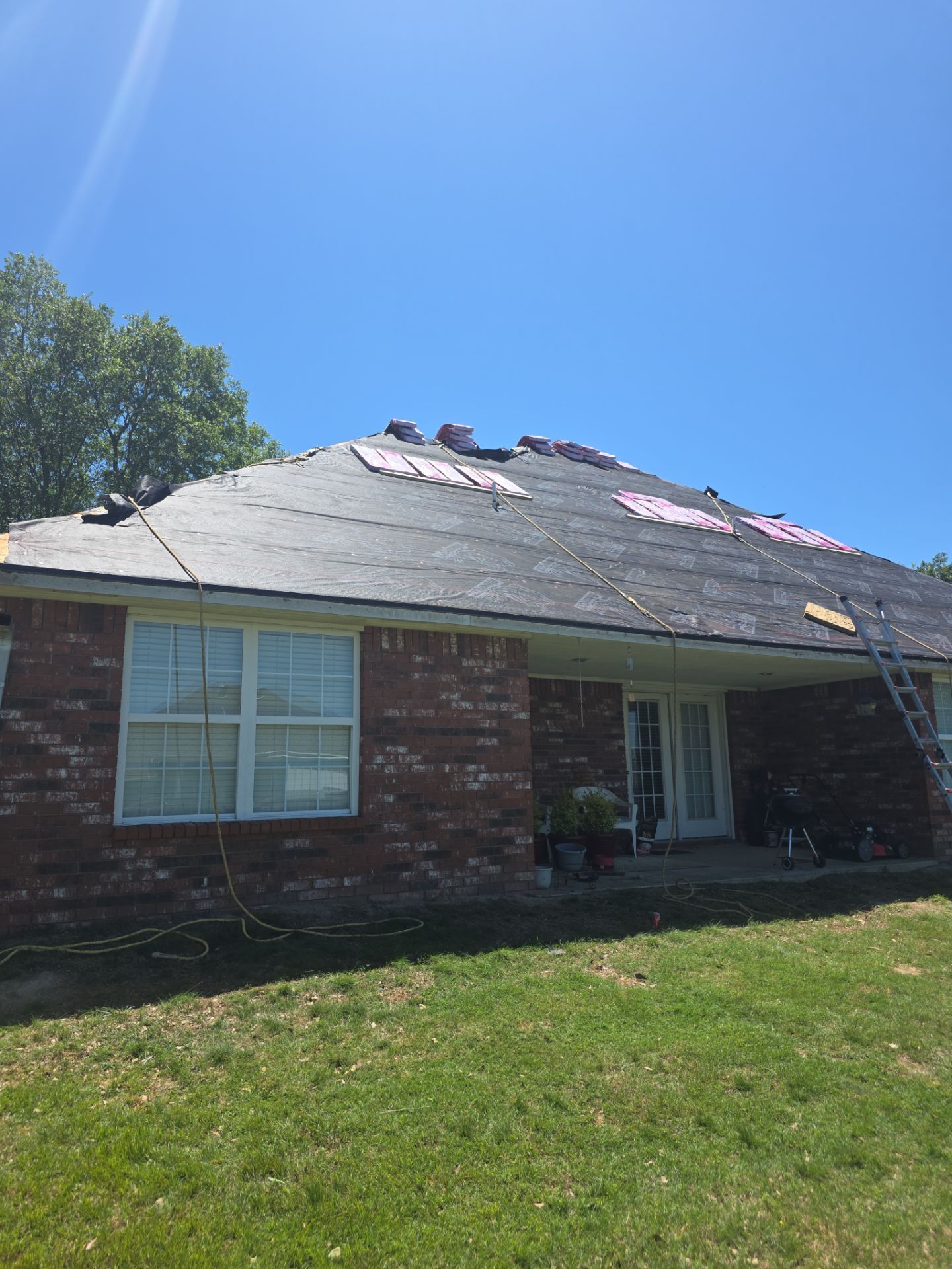 Black roof & gutters!! by In & Out Construction & Remodeling, LLC
