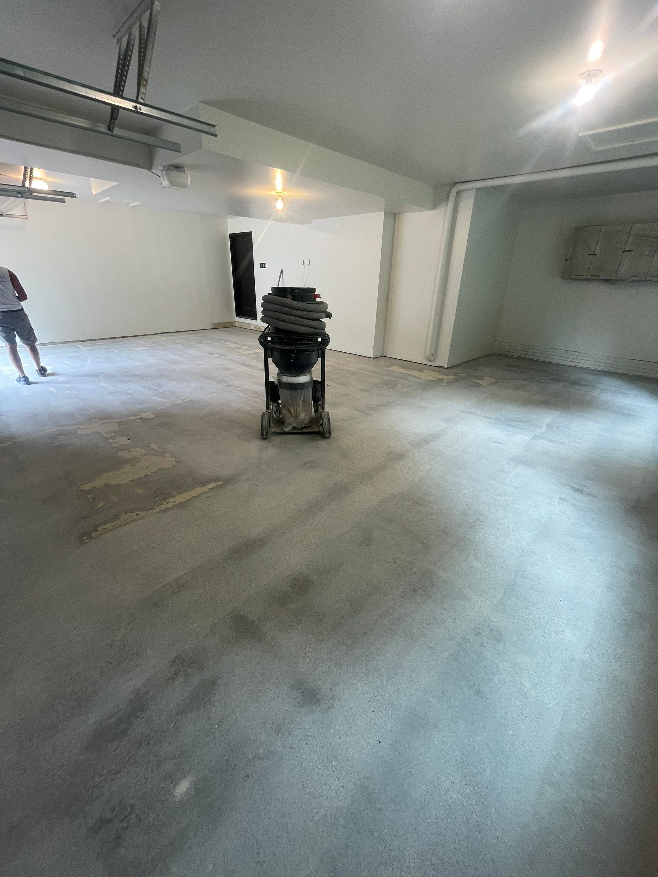 Gray Speckled Epoxy Garage Floor Coating in Sioux Falls by Select Painting, Coatings & Garage Cabinets