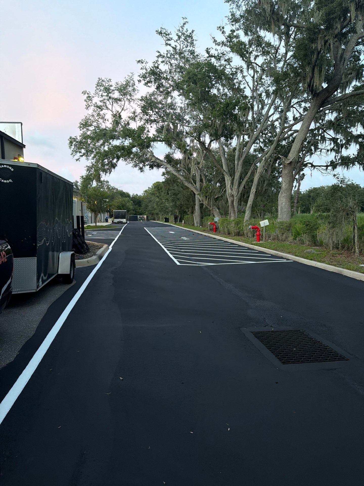 Commercial Asphalt Sealcoating and Line Striping at School House Plaza by Everline Coatings & Services - Southwest FL