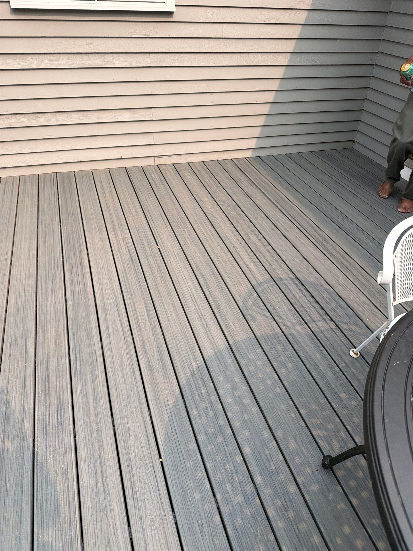 Replacement deck using Trex Tropical Island mist decking and matching cocktail railing. Enclosed with Lattice by DiGiorgi Roofing and Siding Inc