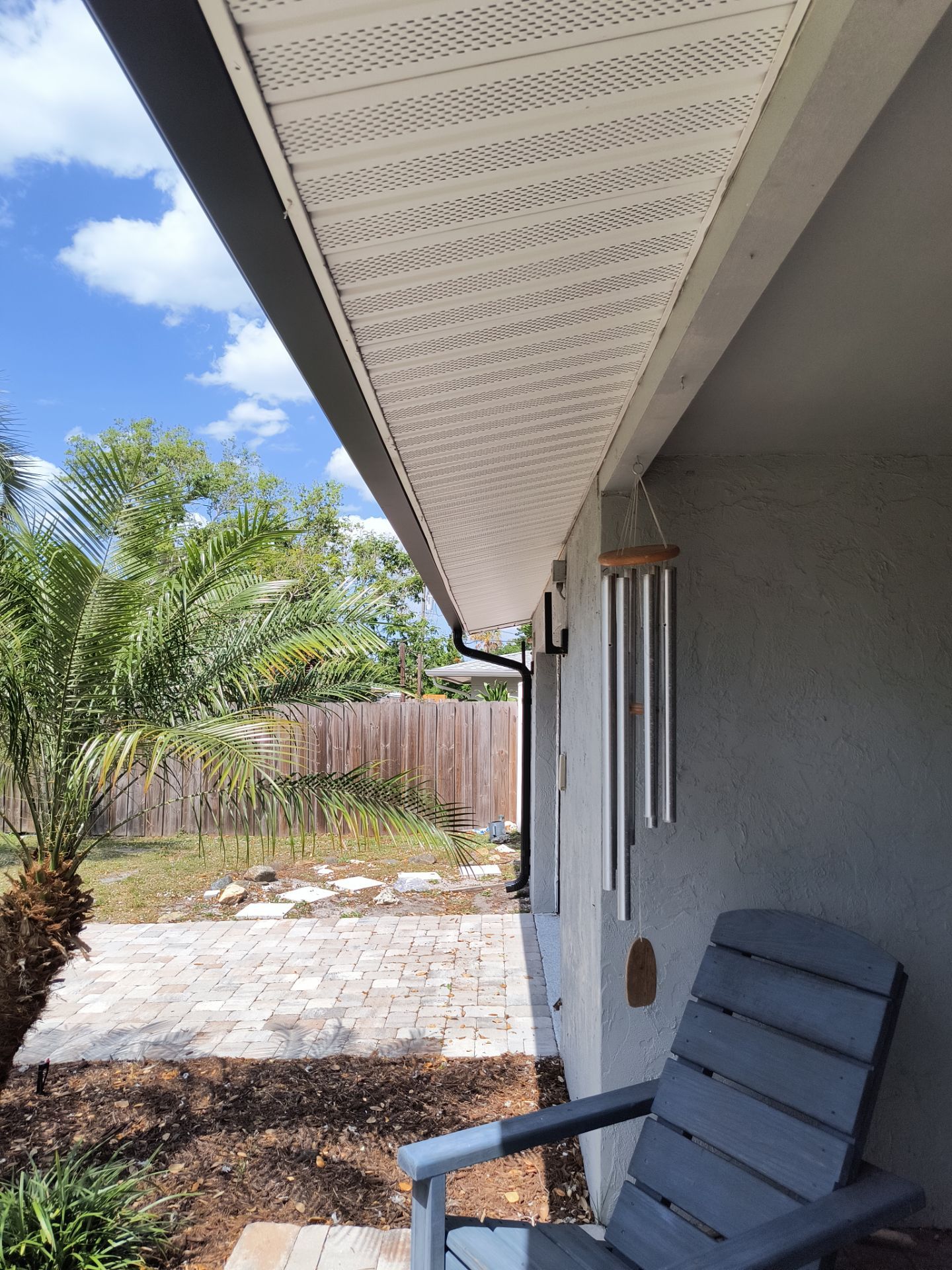 Black Seamless Gutters using 7 inch seamless gutters & New White Soffit in Sarasota FL by Gutter Professors