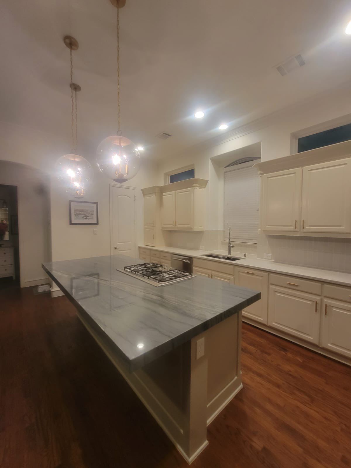 Kitchen Remodel using Quartzite by SLM General Contractors & Roofing