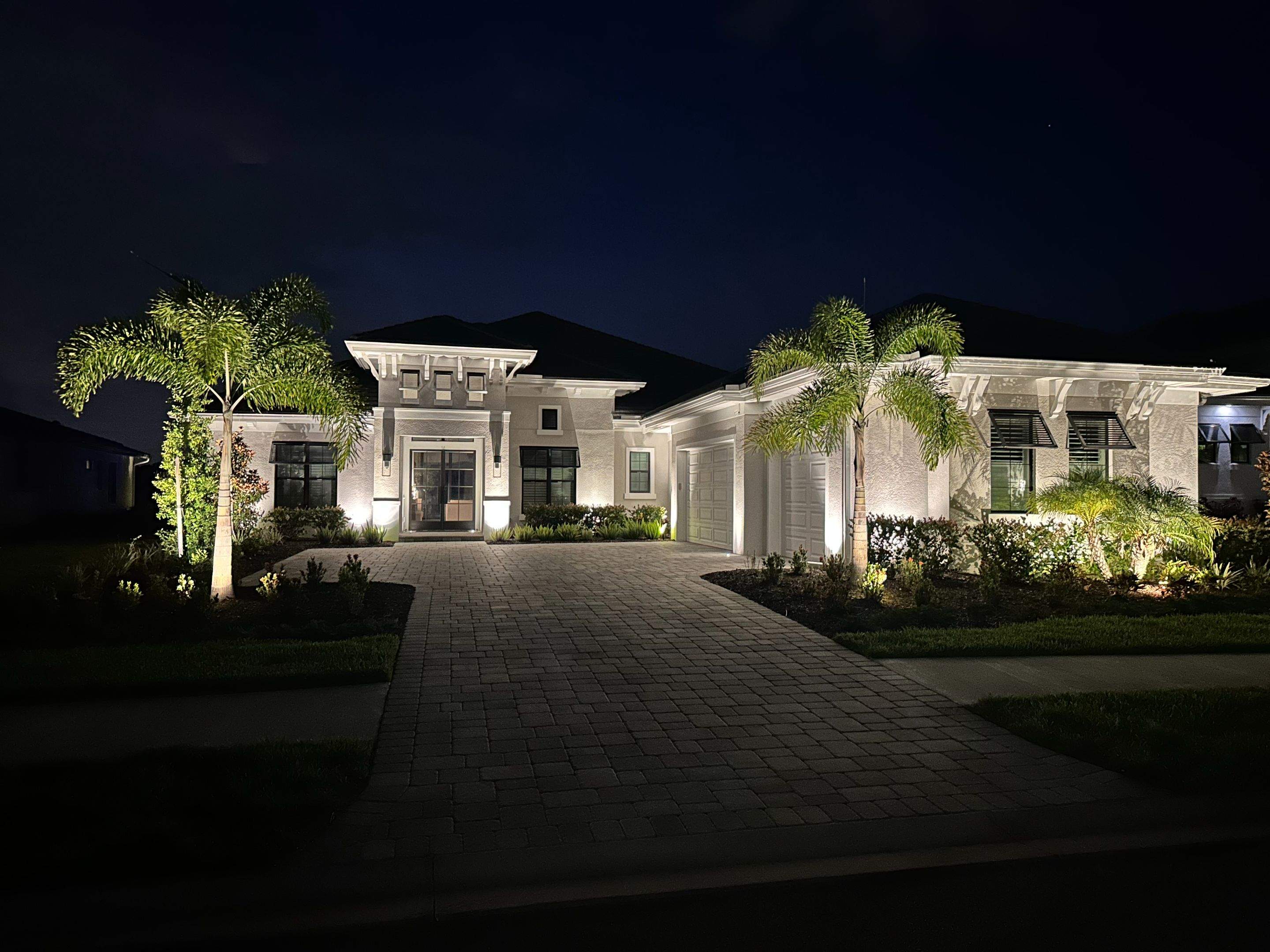 Architectural and Landscape Lighting Installation for Modern Sarasota Home by Illuminate Landscape Designs