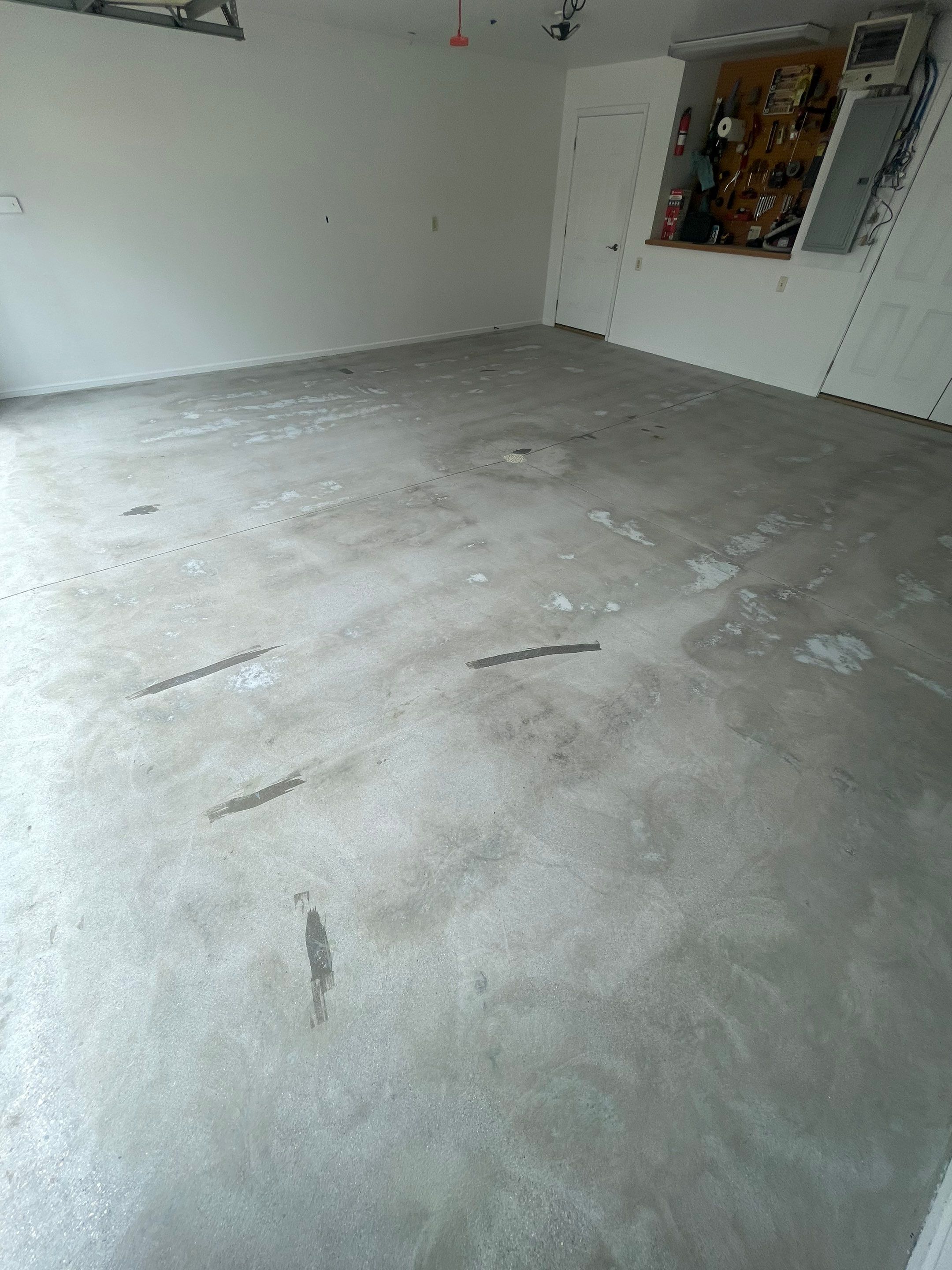 Coyote Flake Garage Floor Coating in Worthington, Minnesota by Select Painting, Coatings & Garage Cabinets