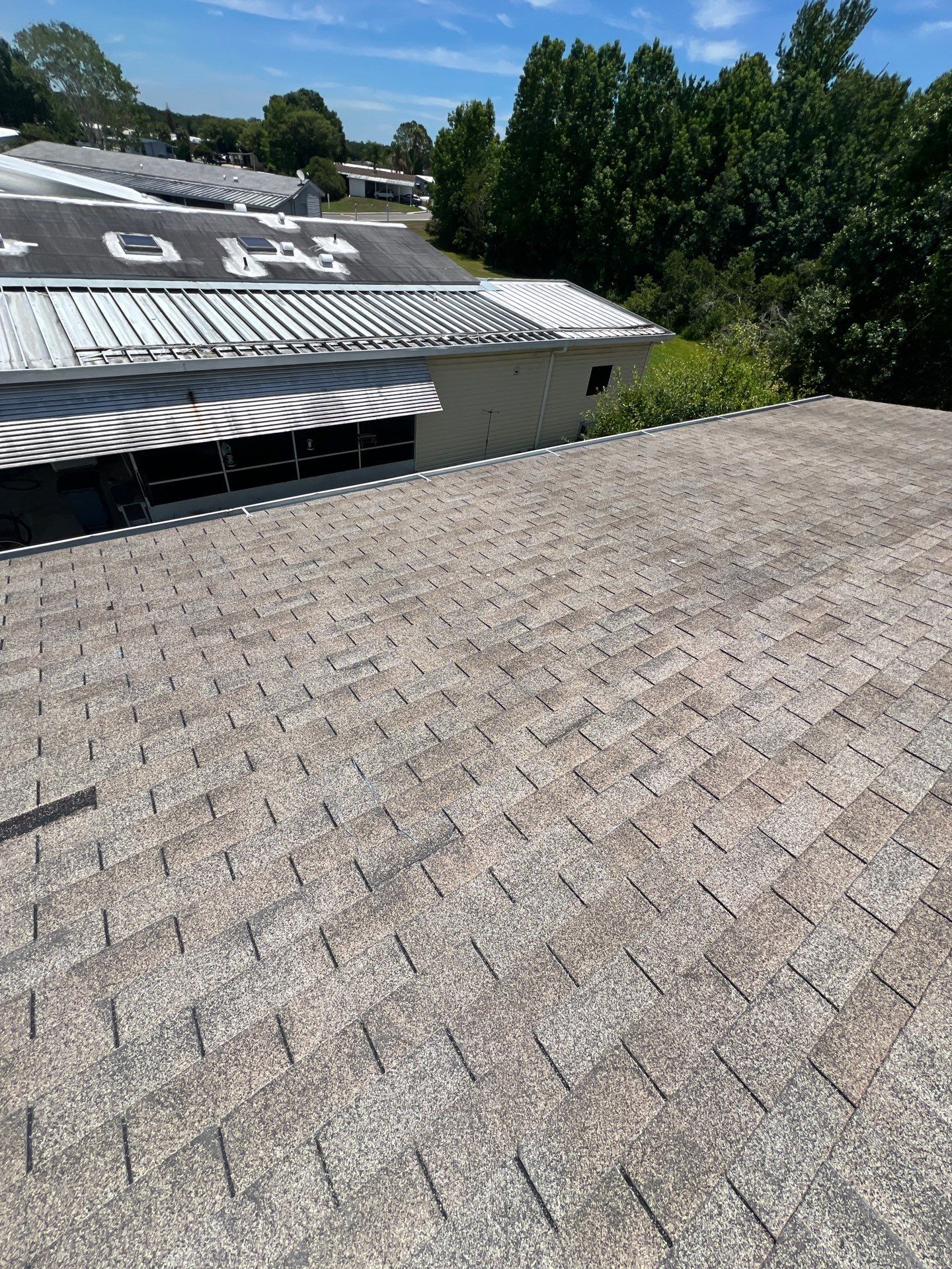 Orlando Residential Standing Seam Metal Roof Installation in Light Stone by Pinnacle Roofing Group