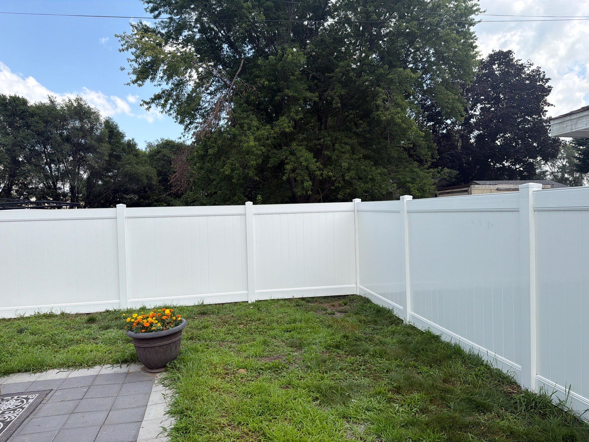 White Vinyl Privacy Fence Installation in Waterloo, Iowa by Perfect Picket Fence and Stain