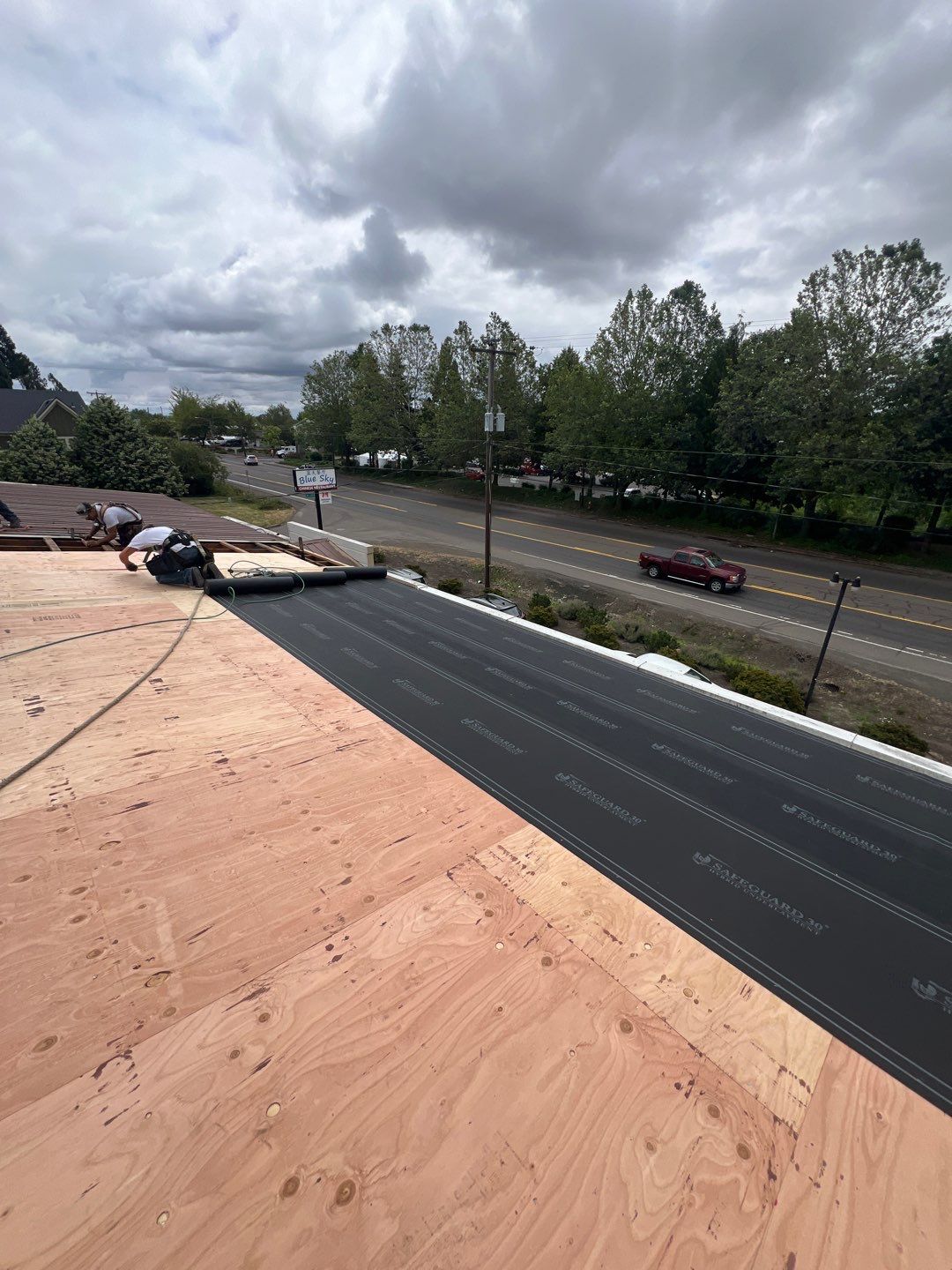 Commercial Flat Roof Installation using Bruce and Dana Snap Lock Metal (Color: Brown) by Orezona Building & Roofing Company, Inc.