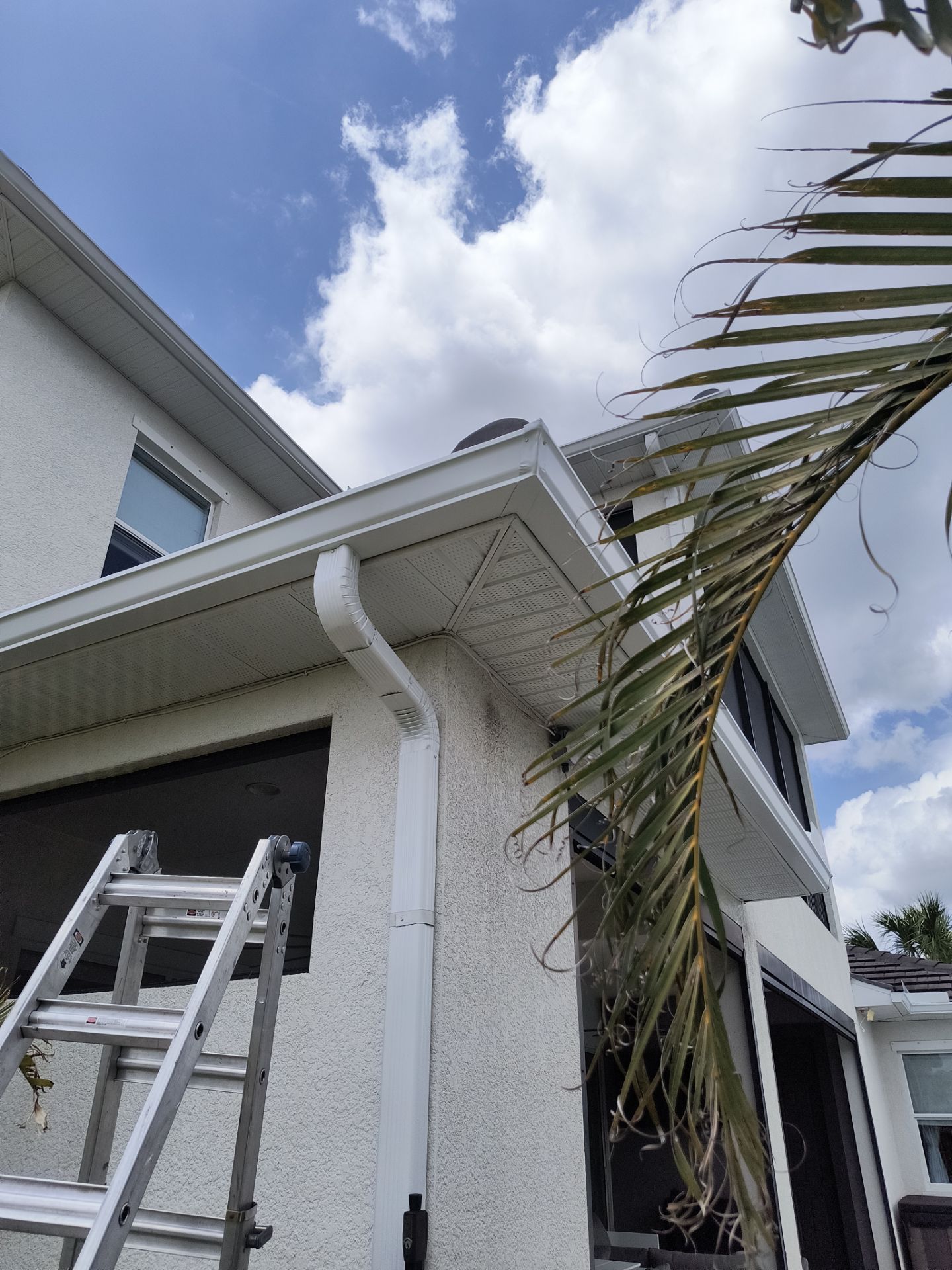 White Seamless Gutters with Downspouts in Bradenton FL by Gutter Professors