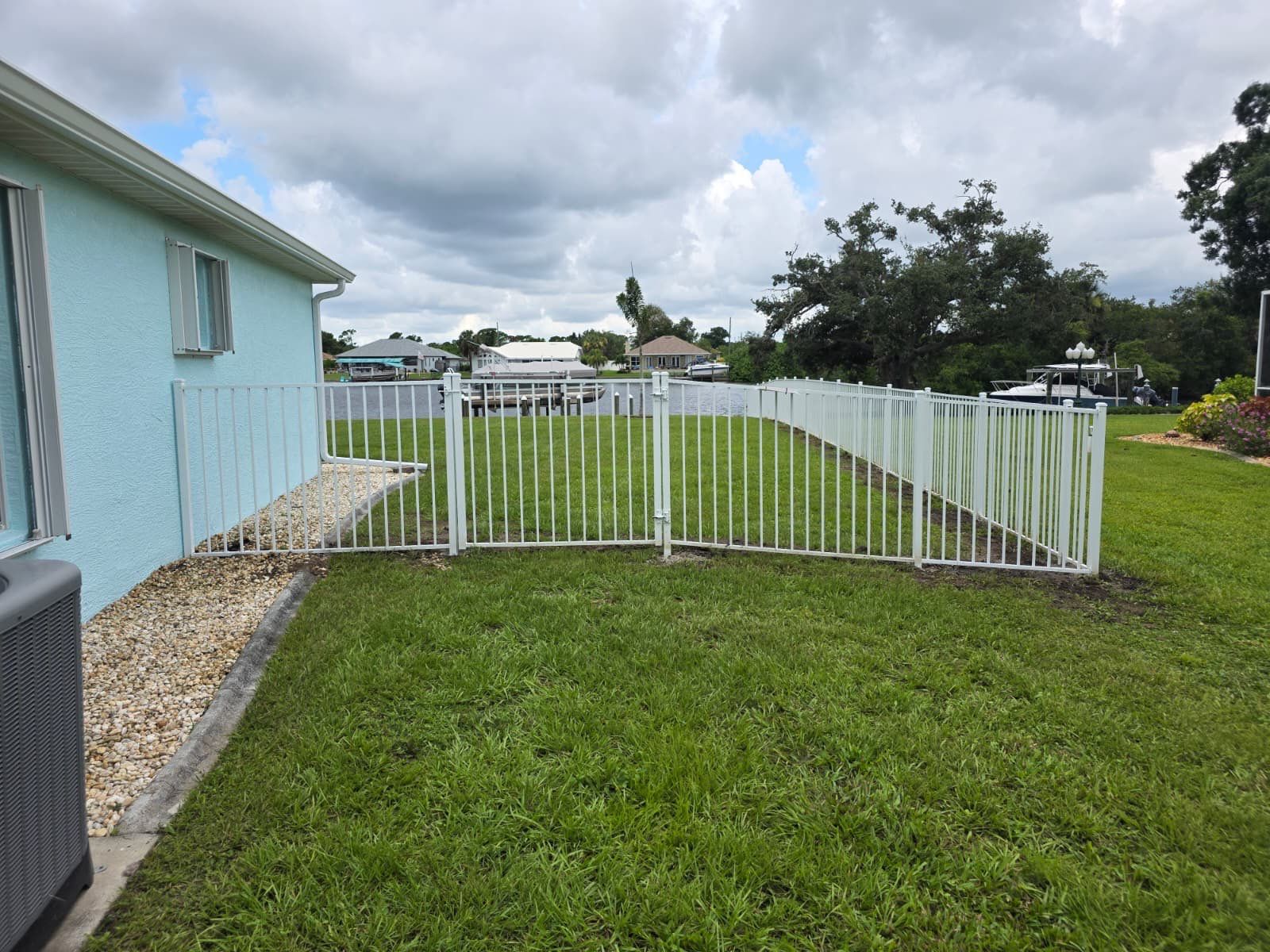White Aluminum Picket Fence Installation for Port Charlotte Waterfront Home by True Fence LLC