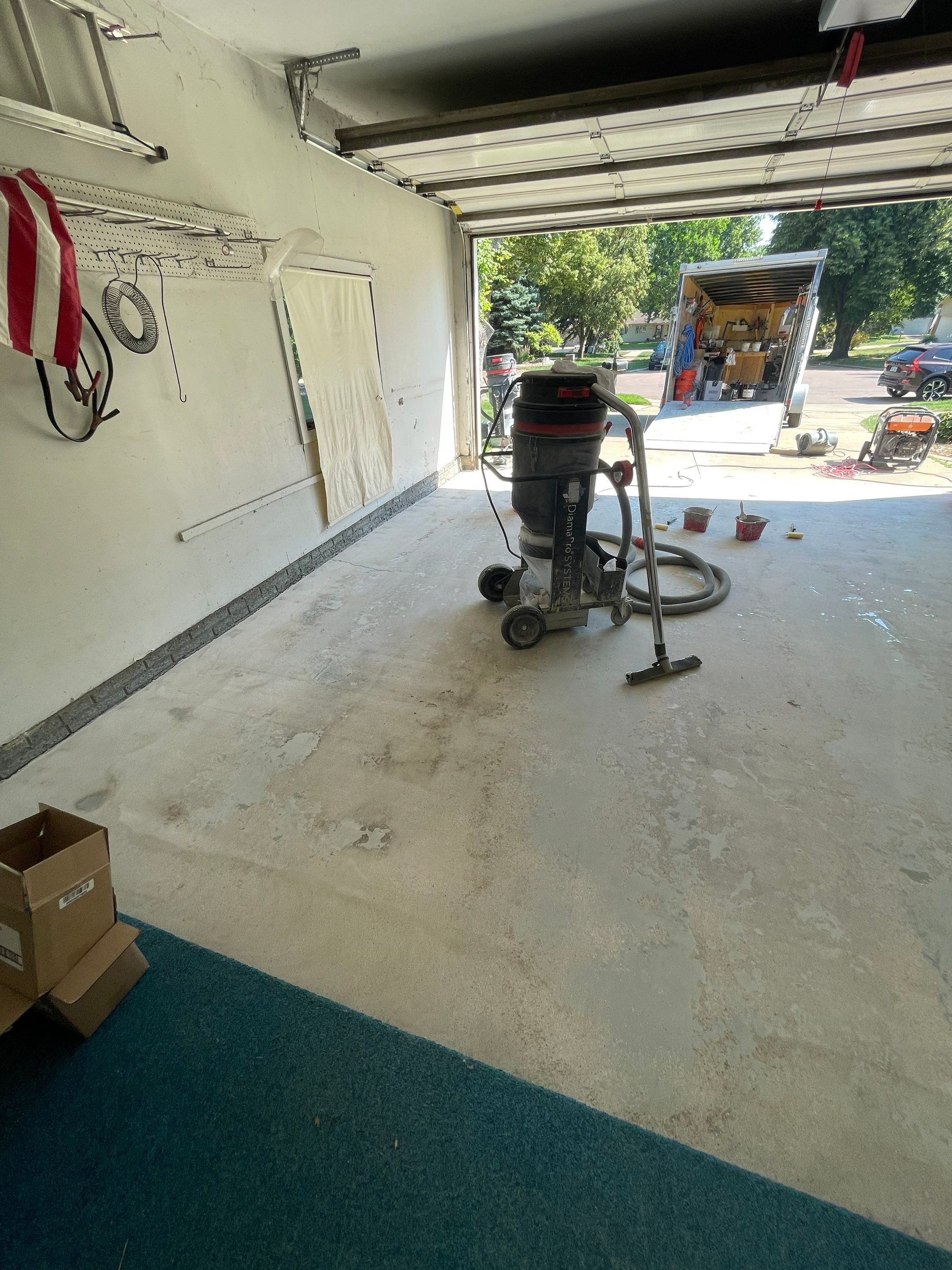 Custom Creekbed Garage Floor Coating in Sioux Falls by Select Painting, Coatings & Garage Cabinets