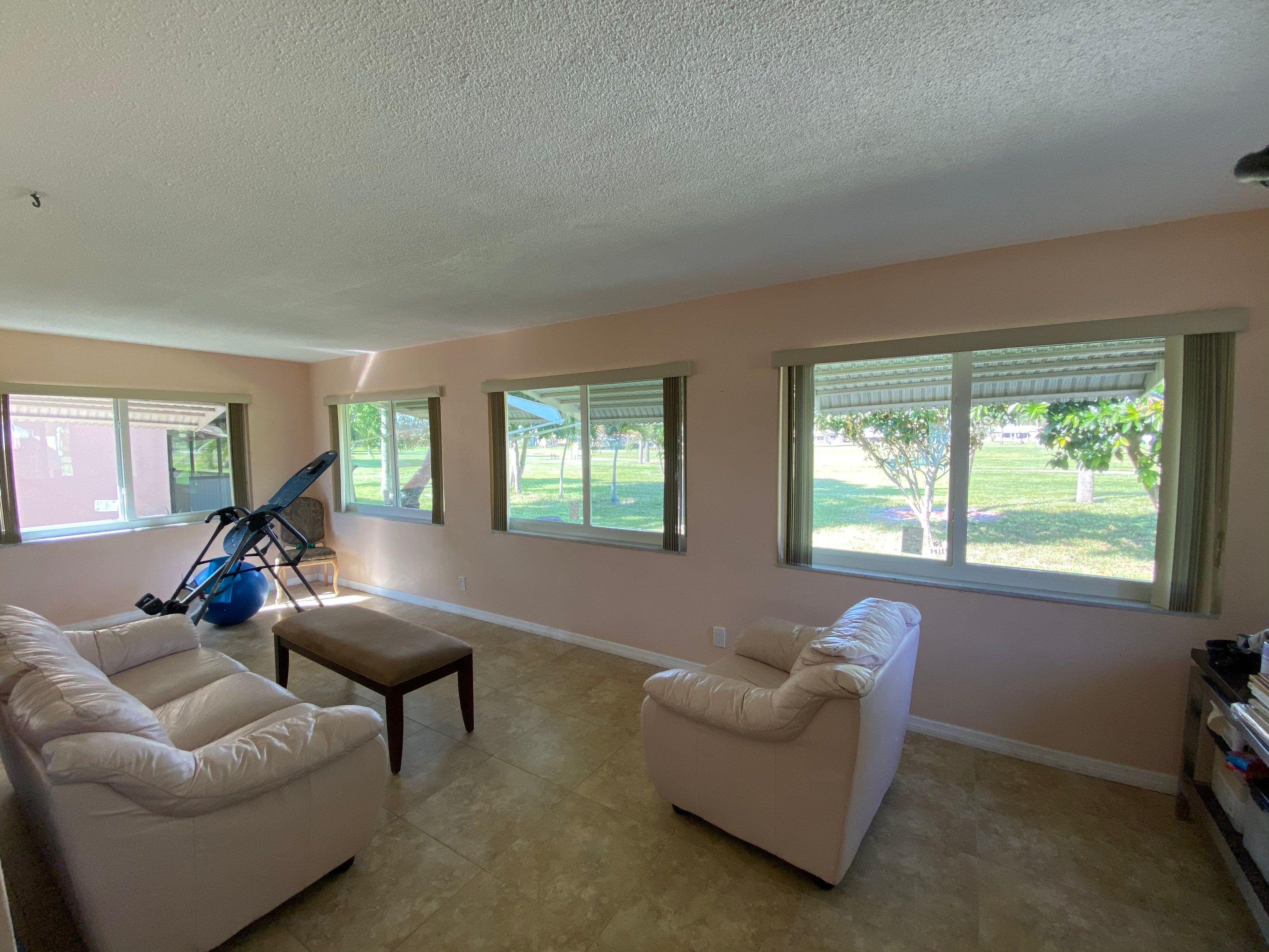 Tamarac Residential Entry Door and Aluminum Window Installation Project by The Door Doctor of South Florida, Inc.