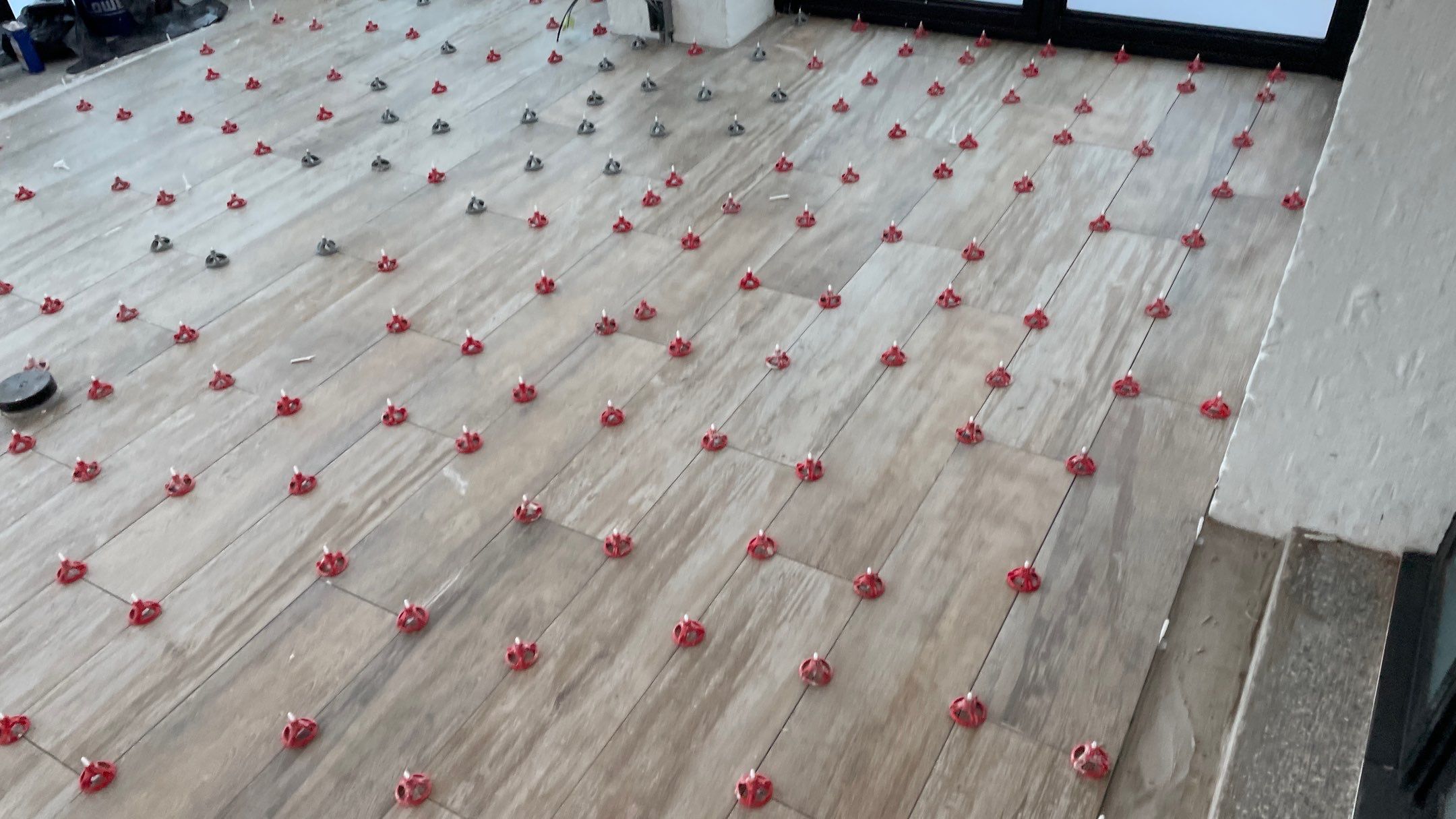 Instant Transformation of this Beautiful Sunroom by Footprints Floors of Coastal Carolina