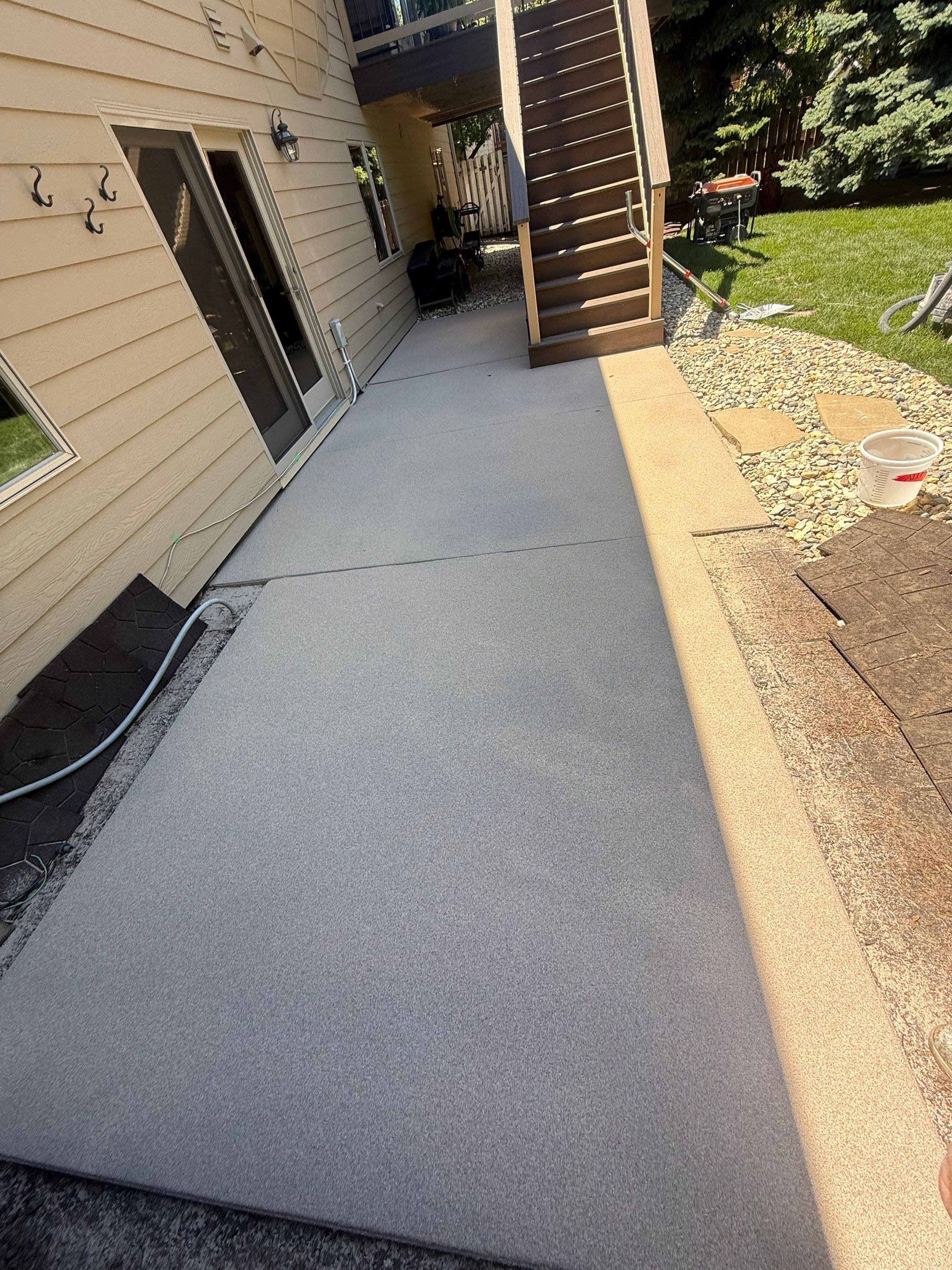 Textured Concrete Coating and Paver Patio Refresh in Sioux Falls by Select Painting, Coatings & Garage Cabinets