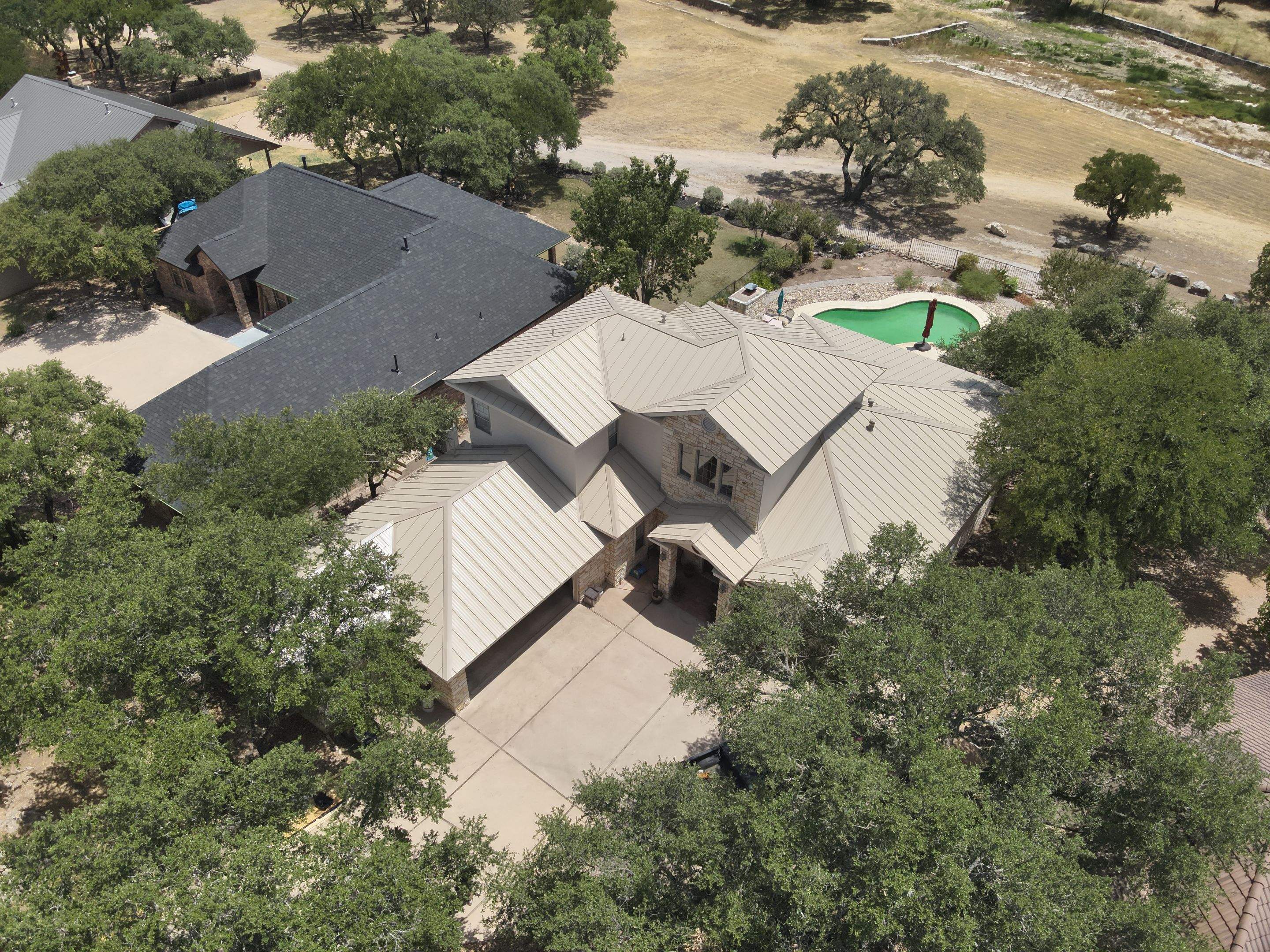 Residential Roof Replacement using 24 GA Double-Lock - Surrey Beige by Action Exteriors Austin