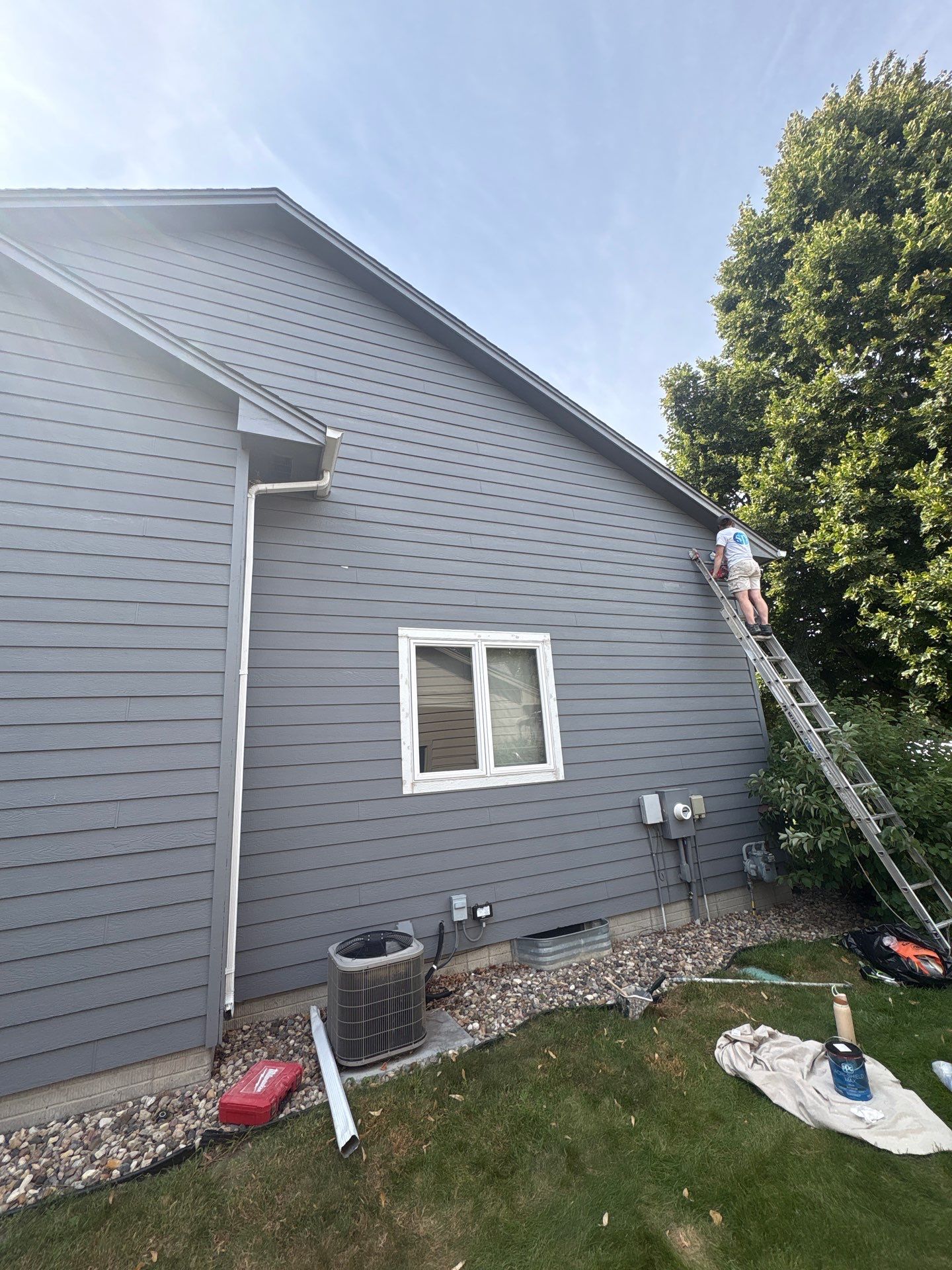 Full Exterior Painting for Gray Siding and Trim in Sioux Falls by Select Painting, Coatings & Garage Cabinets