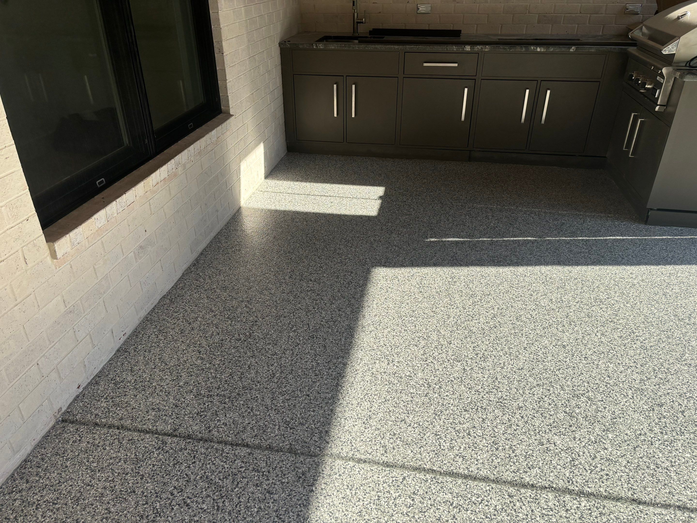 Porch & Garage Using Tidal Wave & Gravel  by Elite Floor Solutions