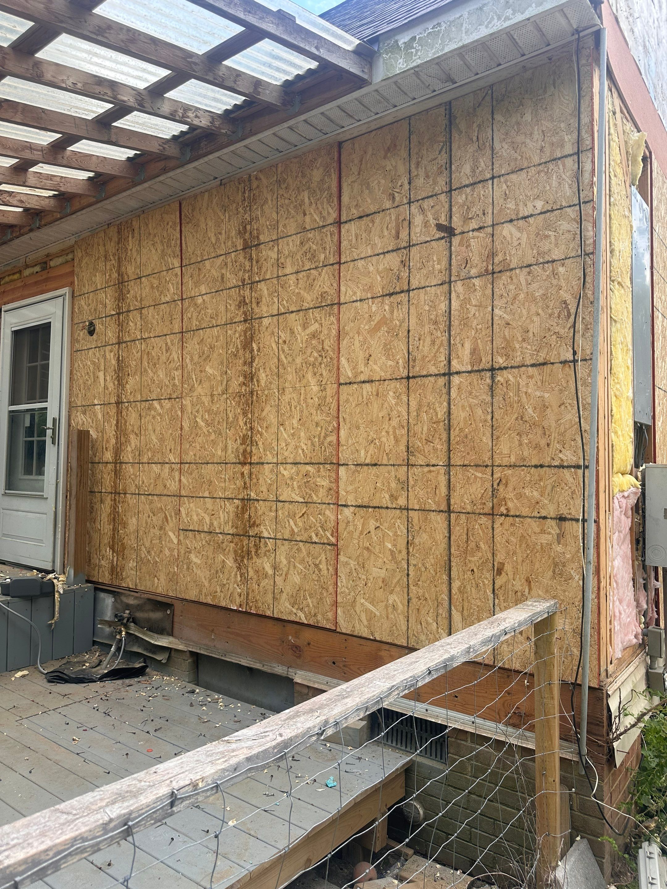 Gloucester Exterior Overhaul with Navy Blue Siding and New Roof by Cade Construction