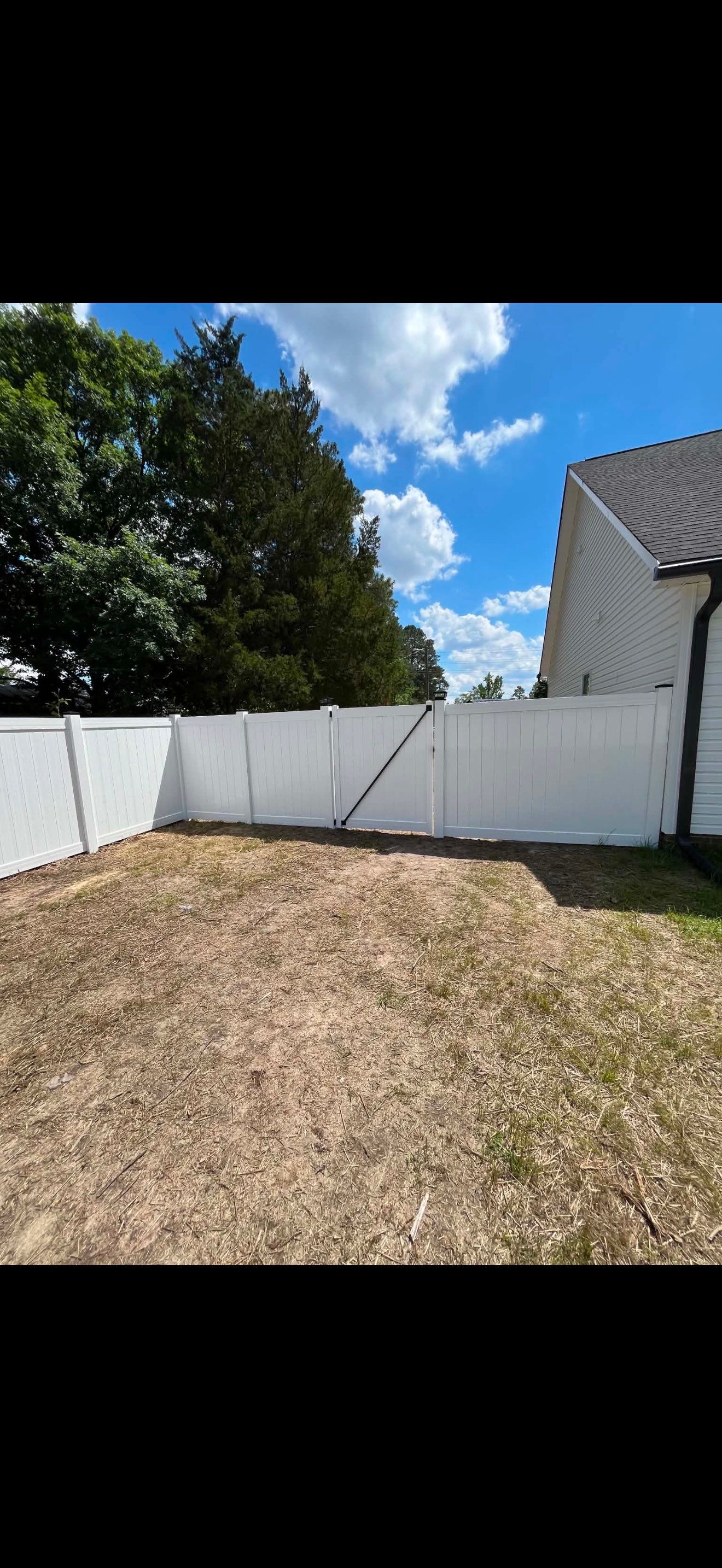White Vinyl Privacy Fence with Solar Post Caps in Goldsboro by Superior Fence and Rail