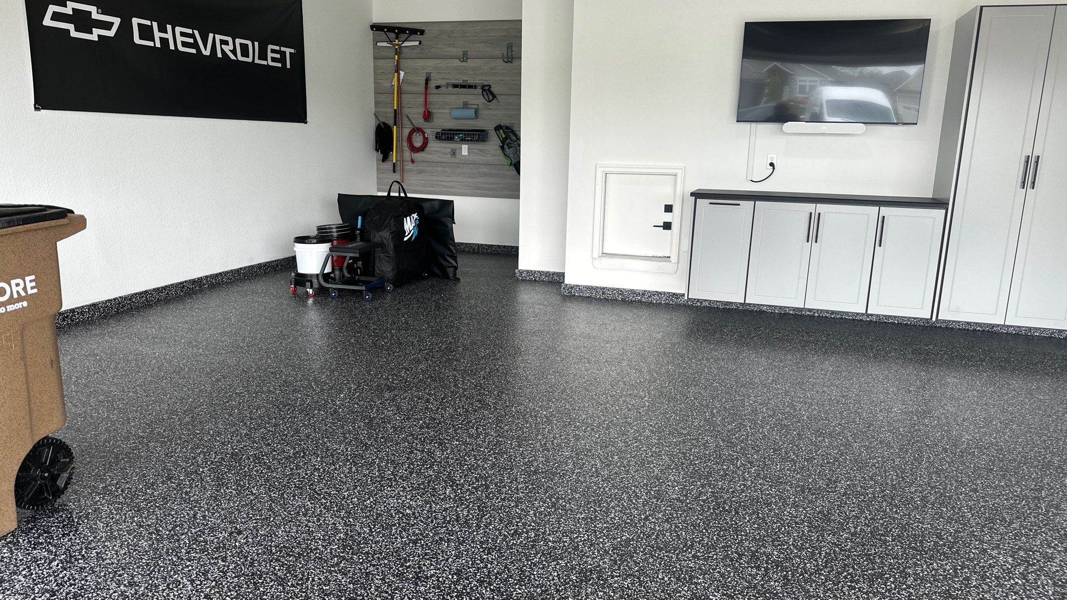 John H. received his dream garage with cabinets and a Banner Garage Floor by Banner Garage