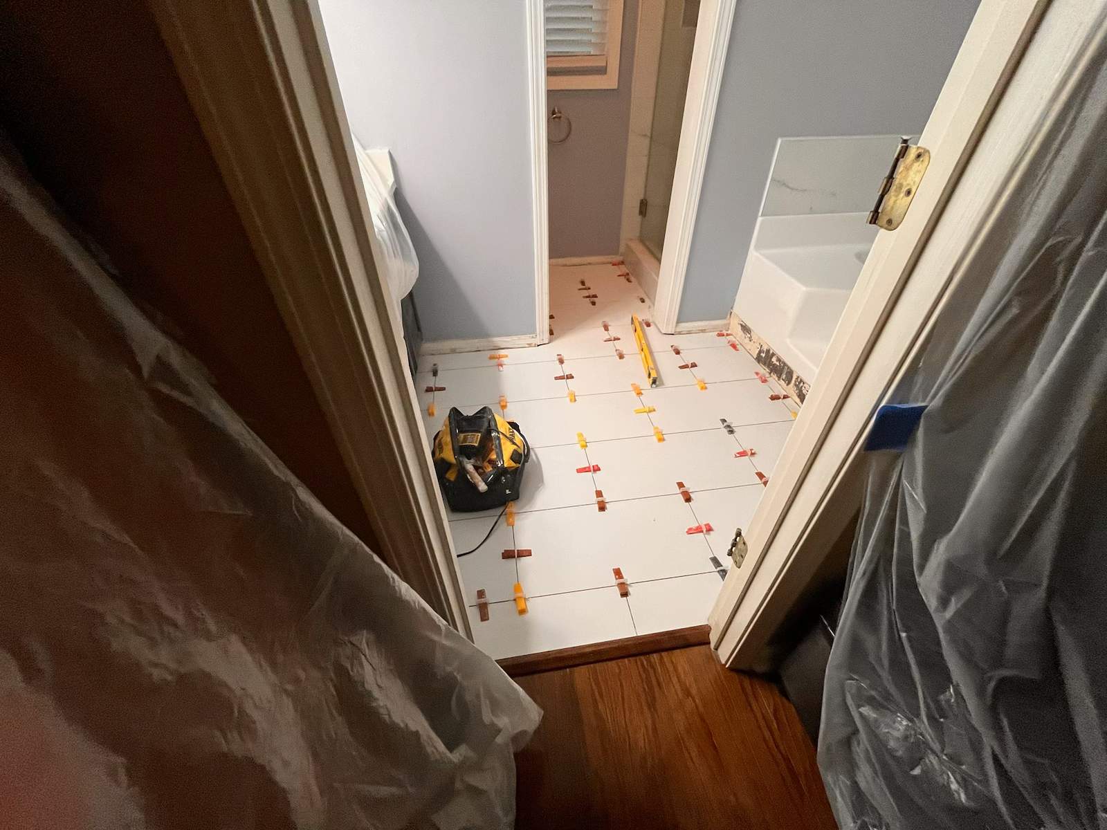 Guest bathroom tub and flooring by Prudencio